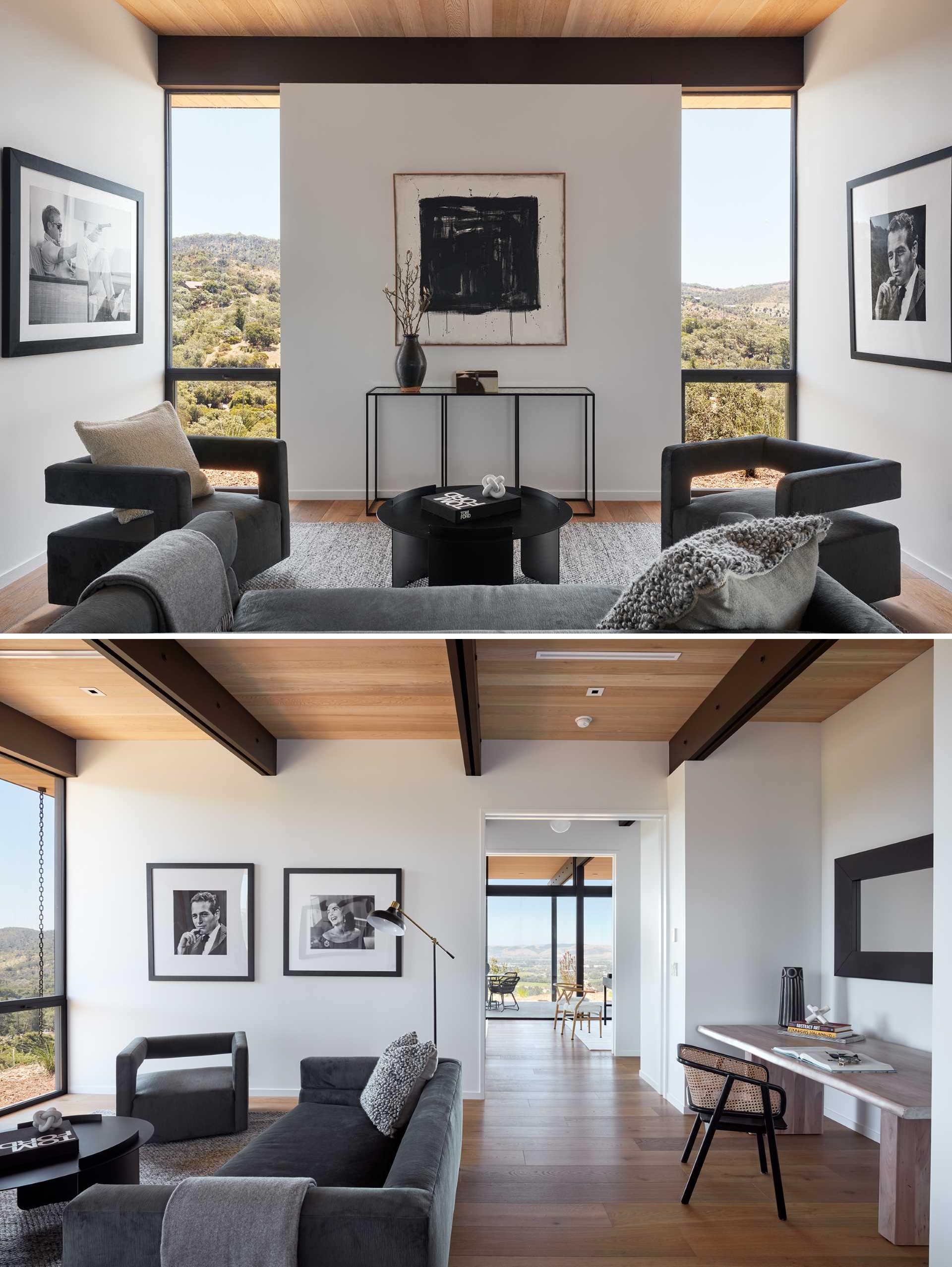 A modern sitting room with floor-to-ceiling windows.