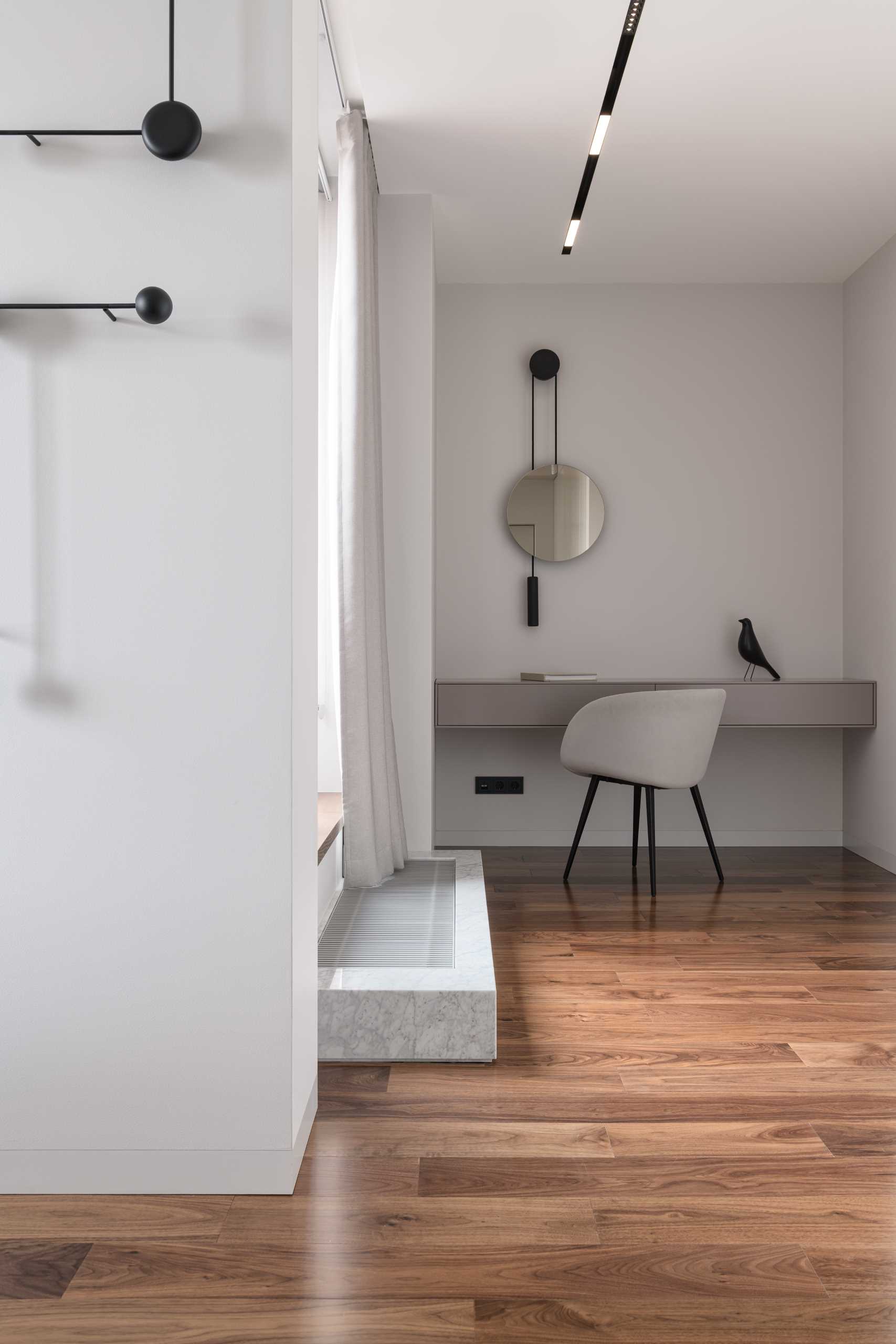 A modern home office area within a bedroom.