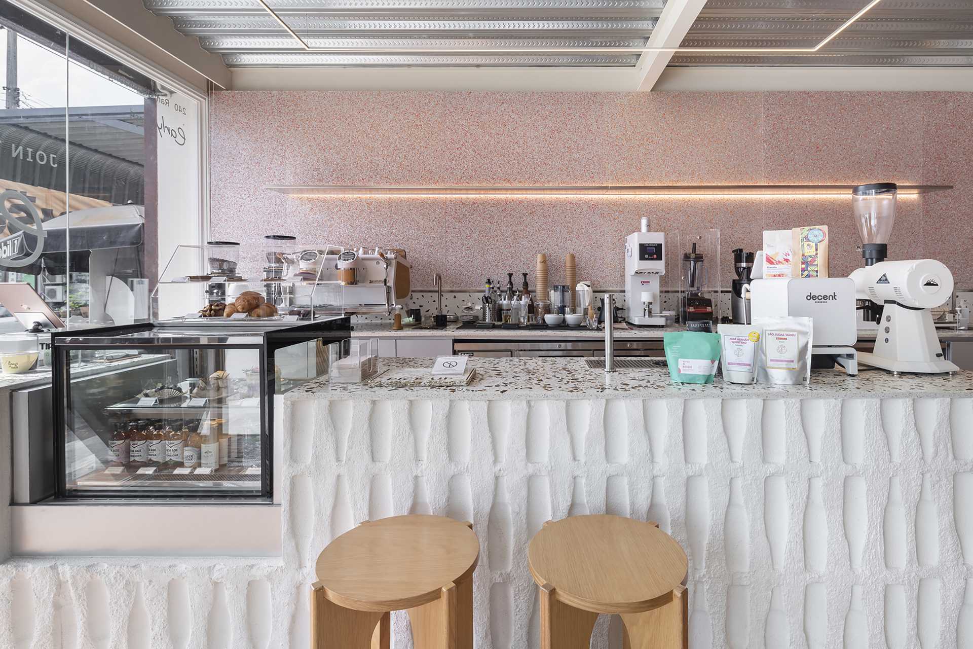 Some of the walls in this cafe are made by bumping bottles into a concrete wall, creating interesting wall patterns and texture.