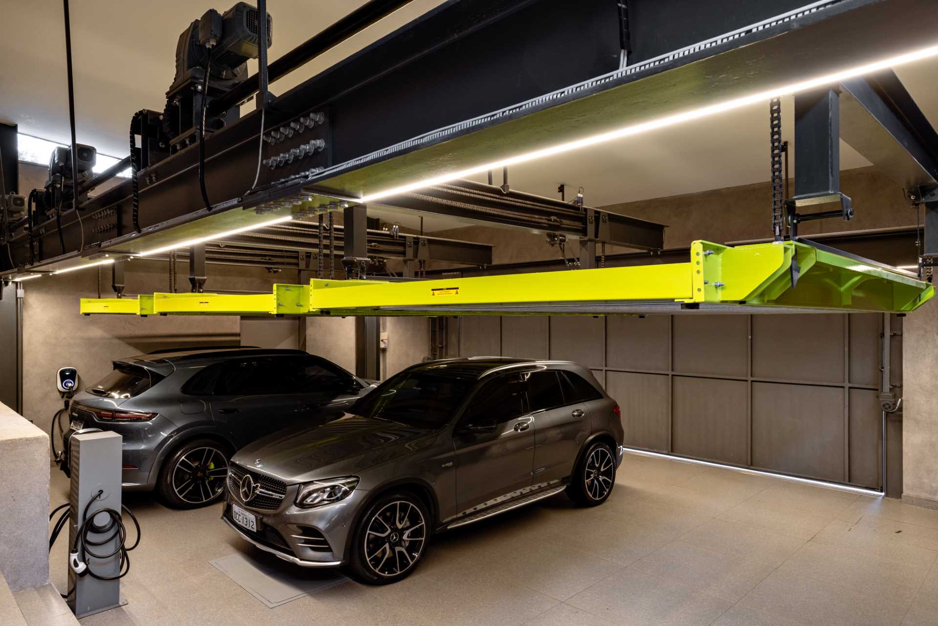 A modern garage with a stacking system.