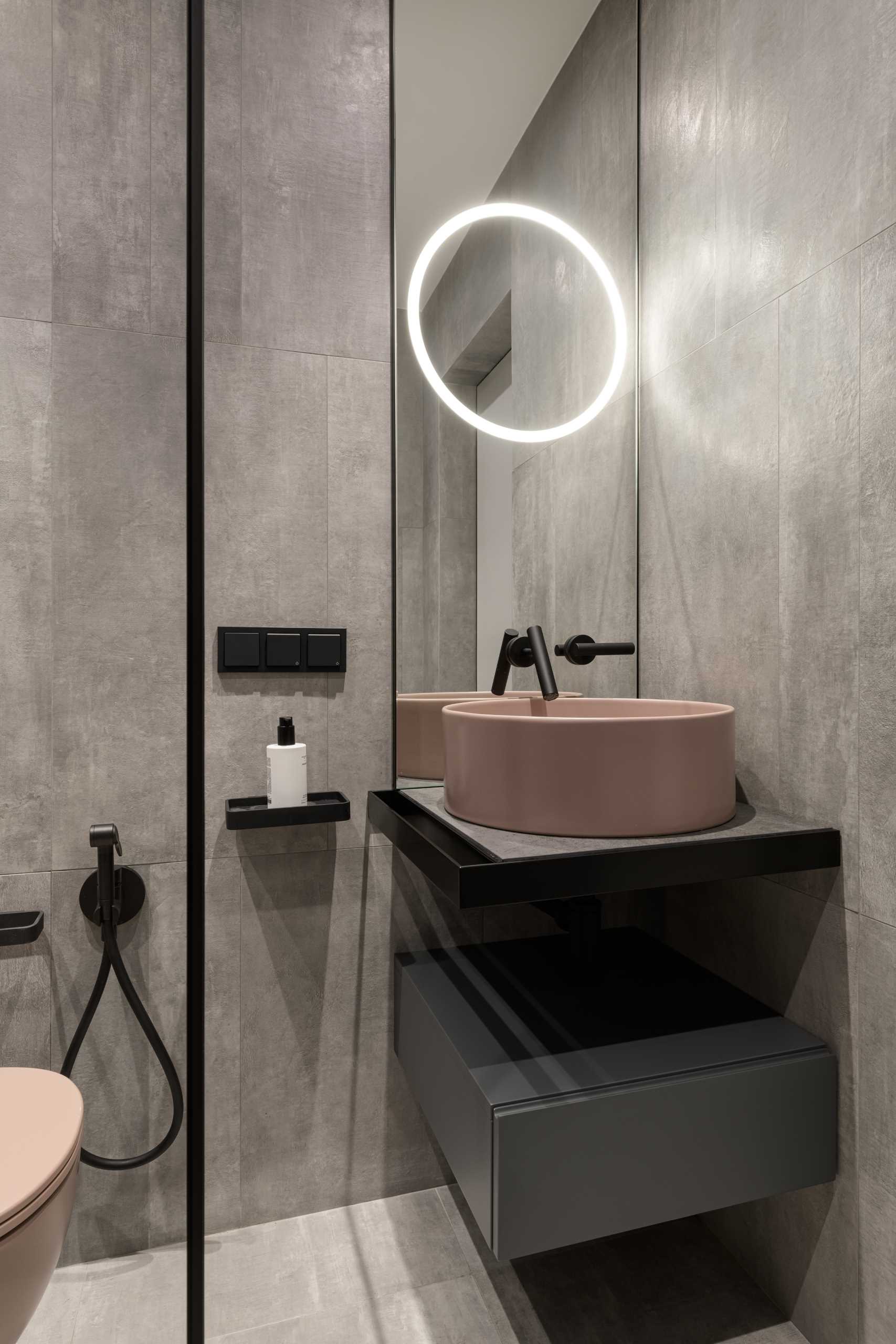 A modern bathroom with black accents.