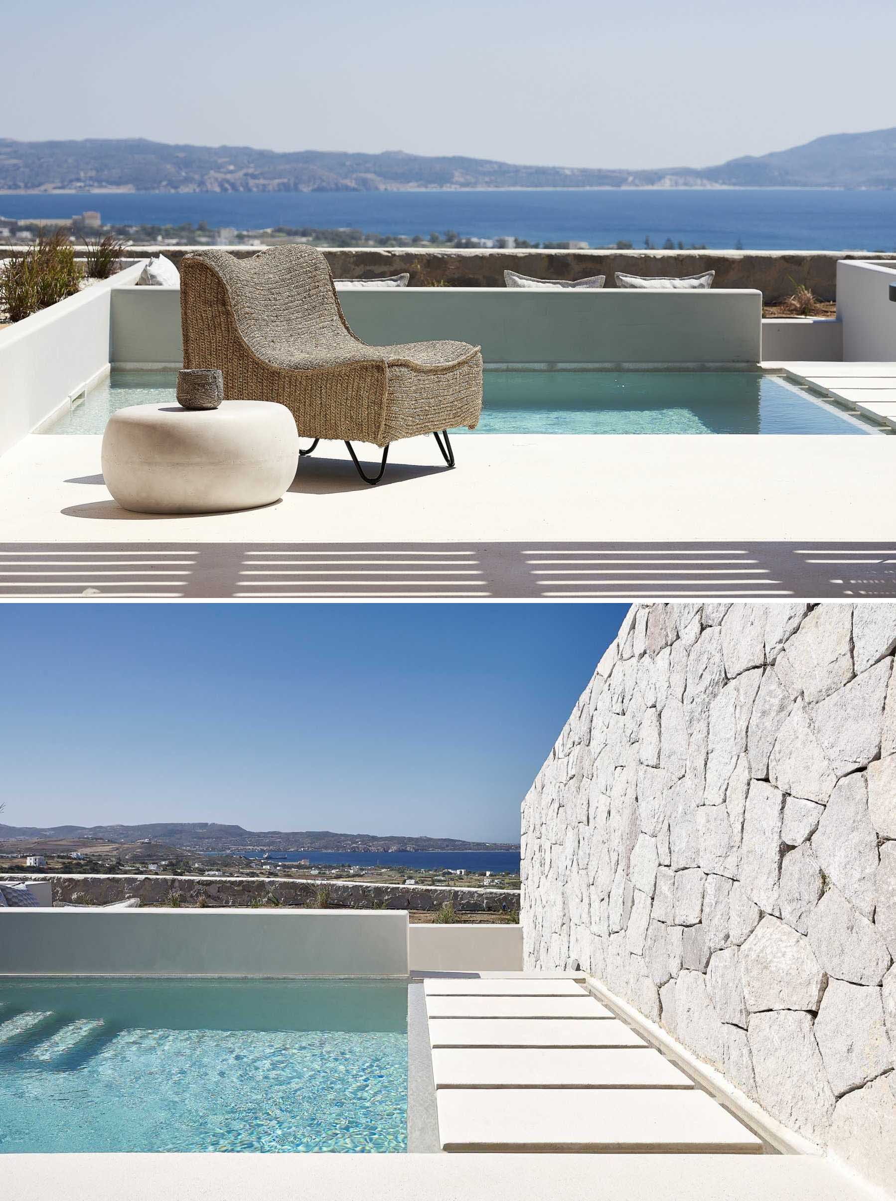 Designed to blur the lines between indoor and outdoor living, this Greek villa includes a terrace framed by a rectangle pool and a grey stone wall.