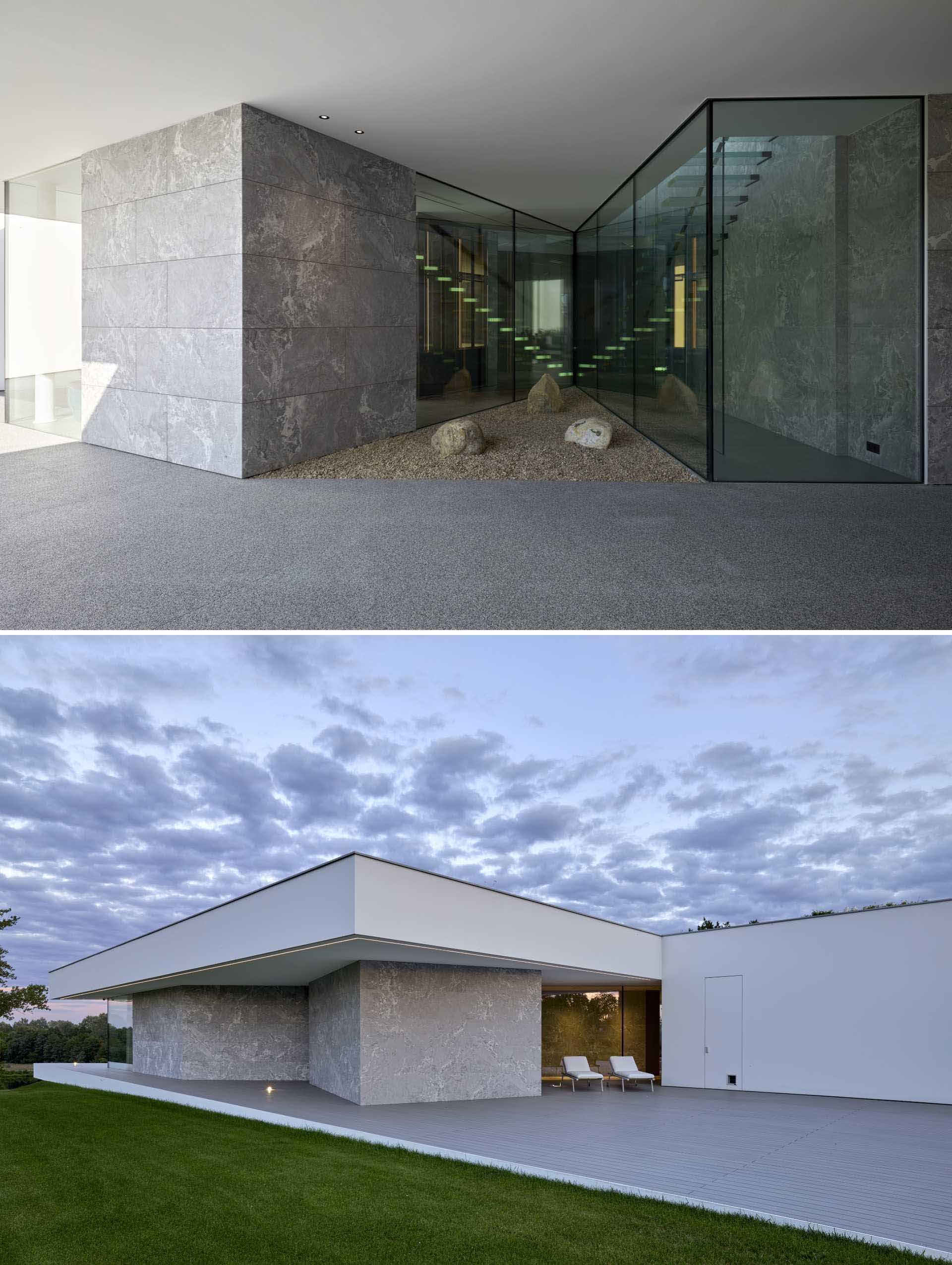 The glass walls have been used in areas of this modern home that are darker, allowing natural light to filter through.