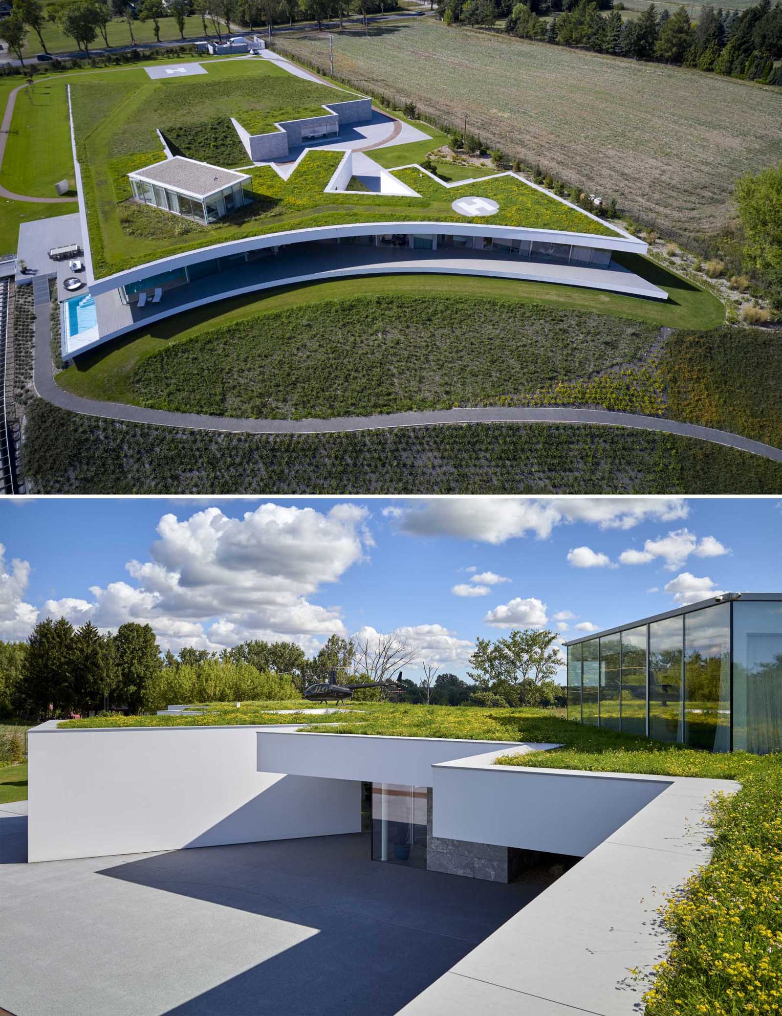 Not only does this modern house have a large green roof, it also has a curved design on one end, that overlooks the landscape and river below.