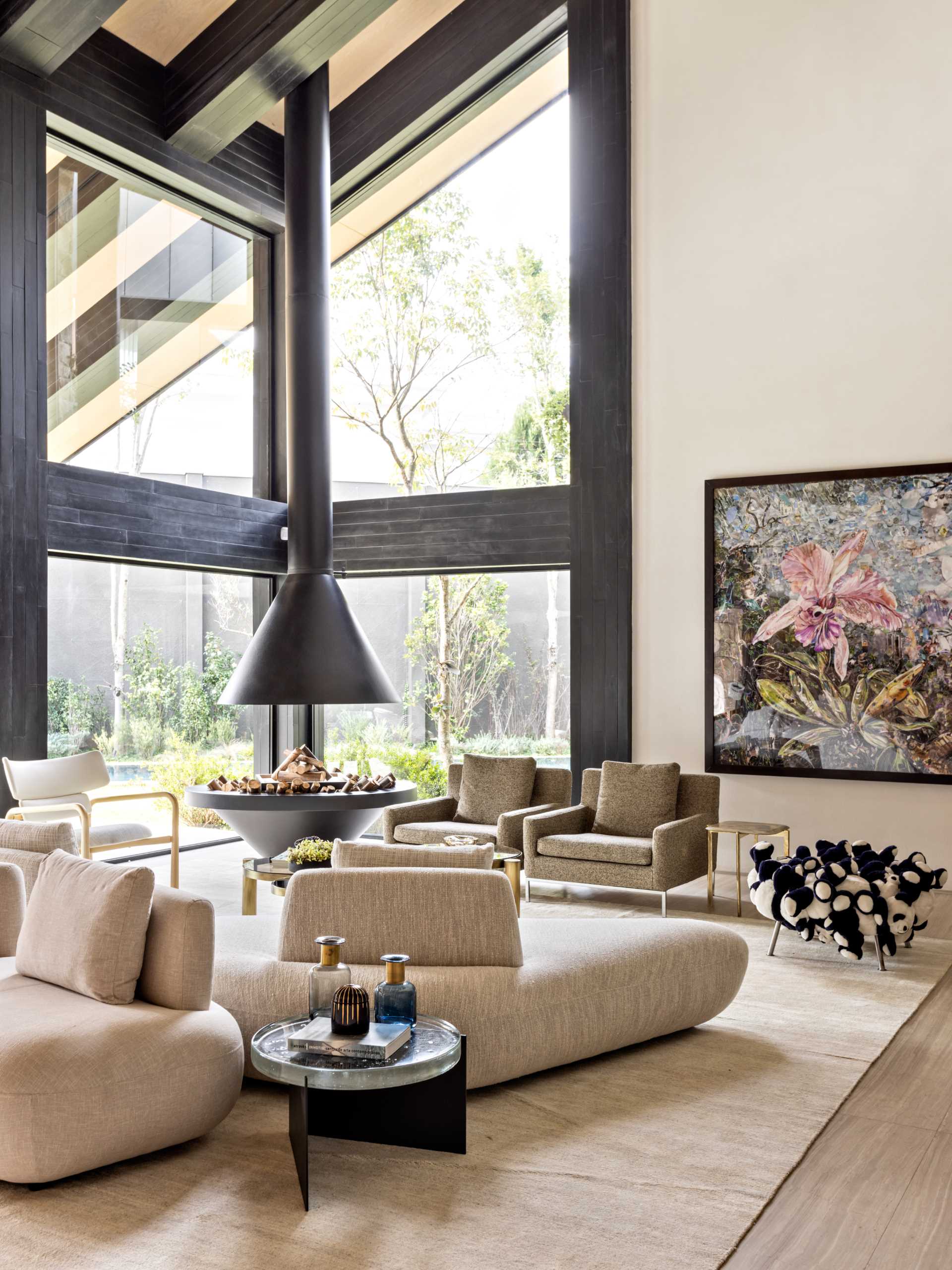 A modern black fireplace matched the stained wood structural details of this modern home.
