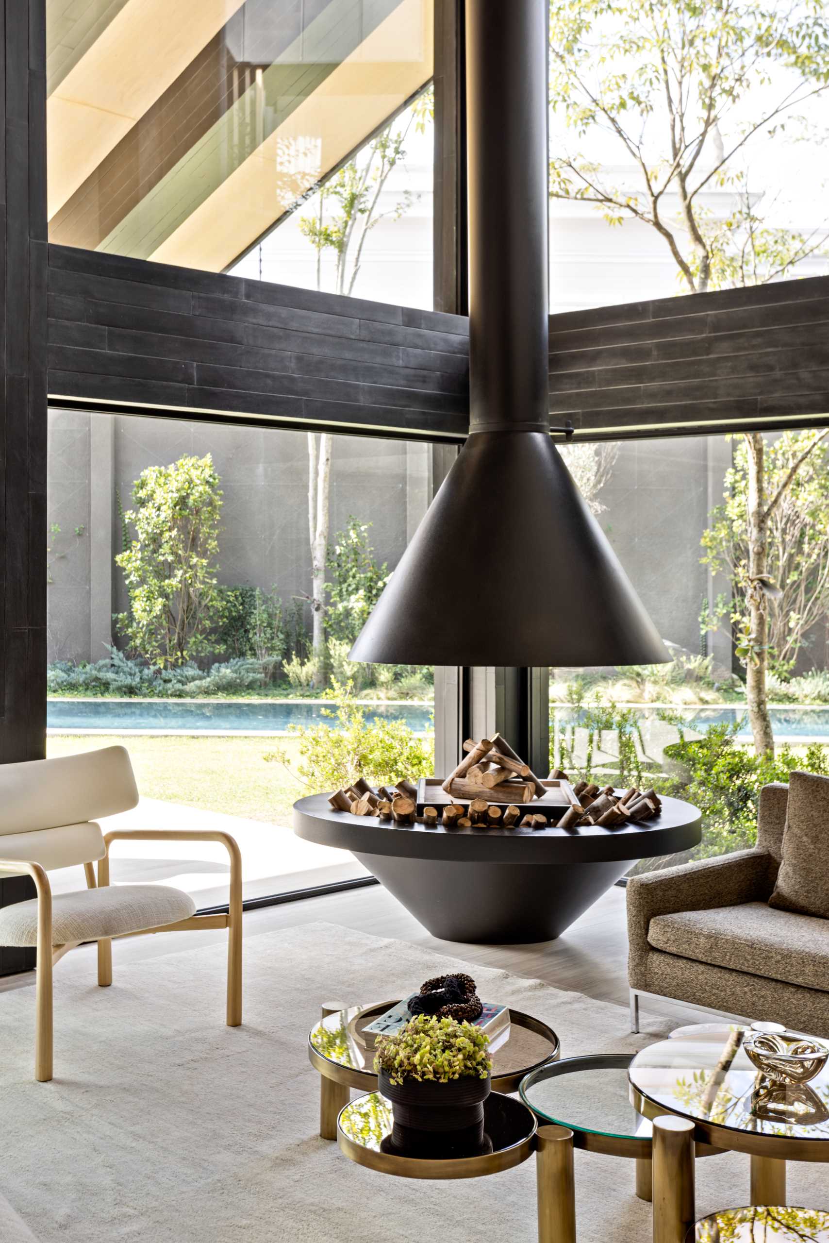 A modern black fireplace matched the stained wood structural details of this modern home.