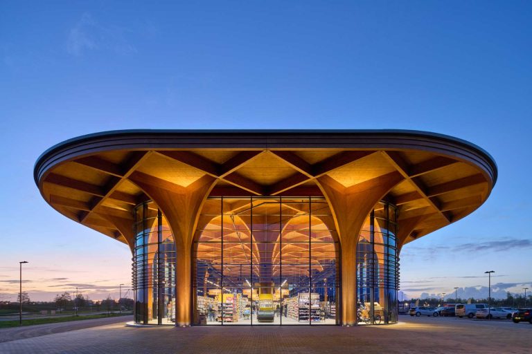 Elegant Cathedral-Like Wood Columns Support A Canopy Over This New Supermarket