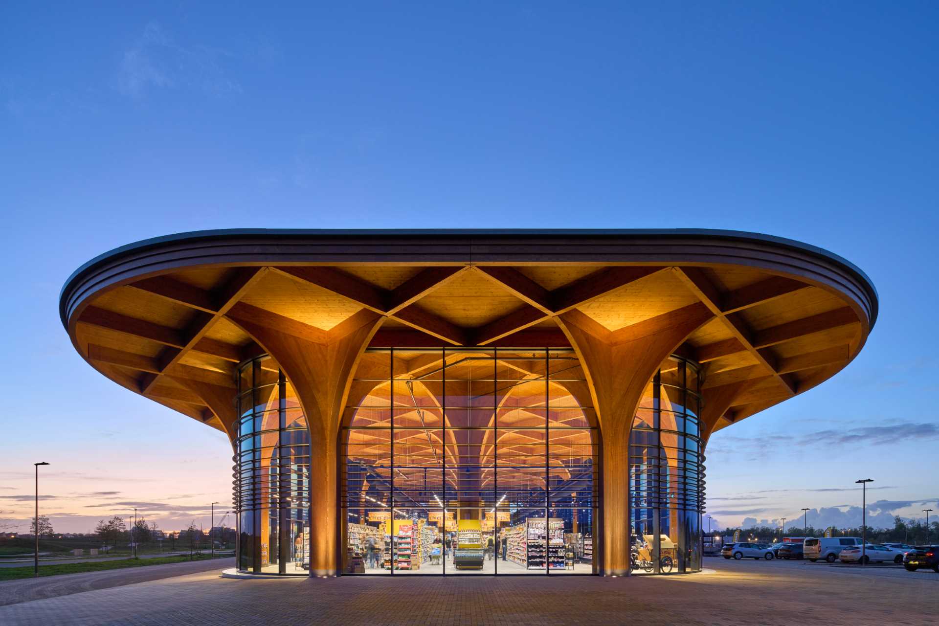 A modern supermarket with an exposed wood structure with a cathedral-like appearance.