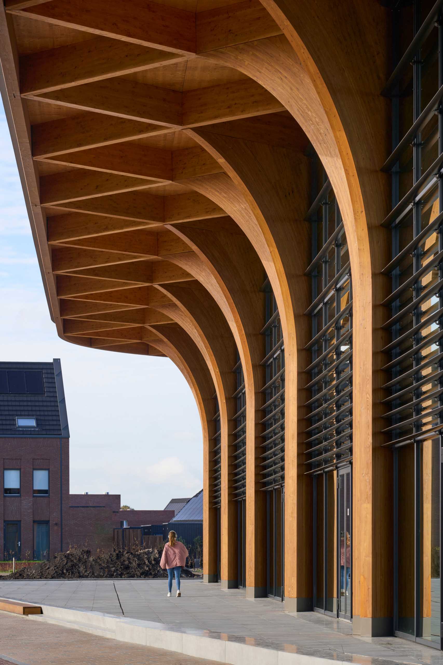 A modern supermarket with an exposed wood structure with a cathedral-like appearance.