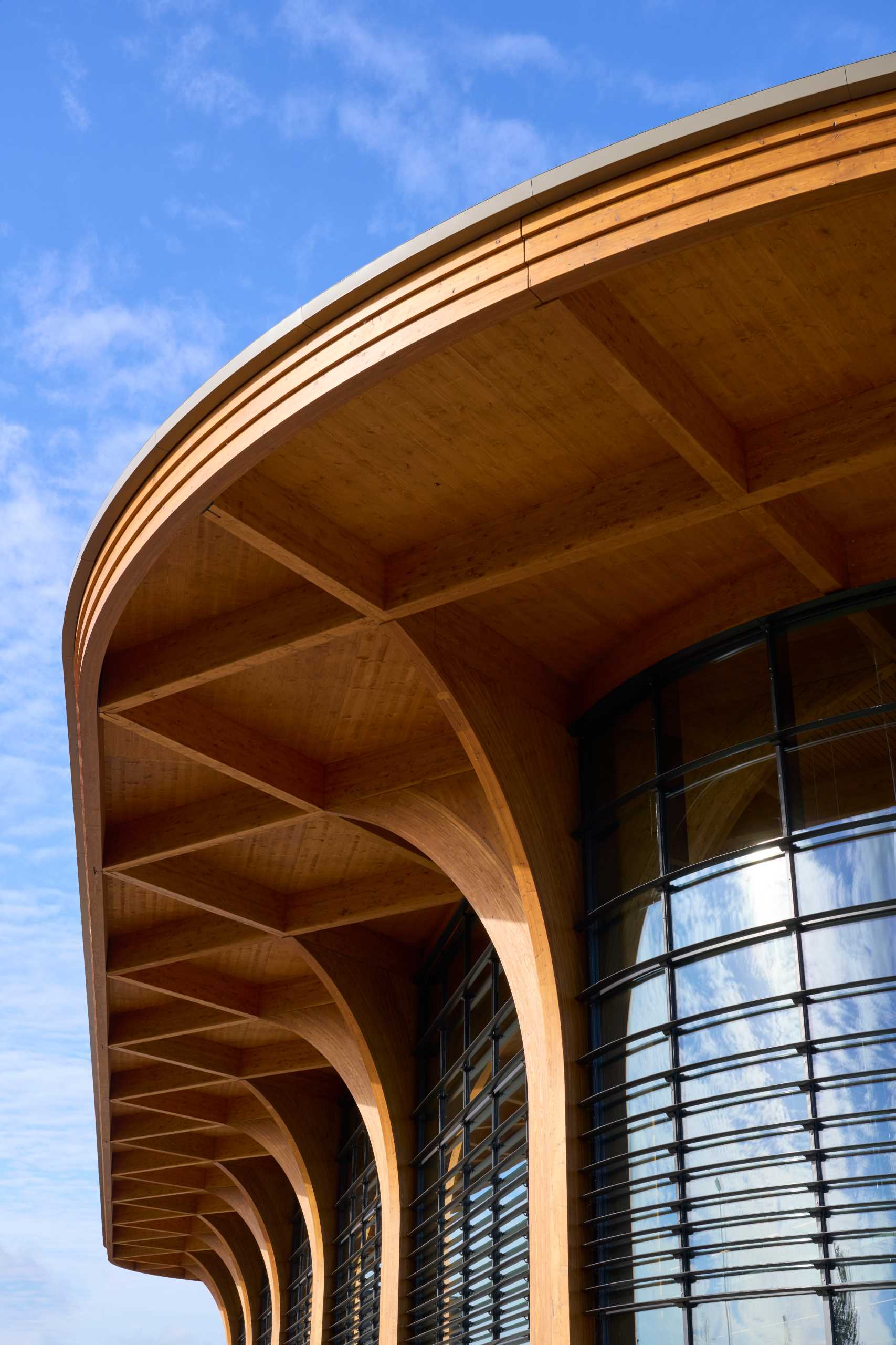 A modern supermarket with an exposed wood structure with a cathedral-like appearance.