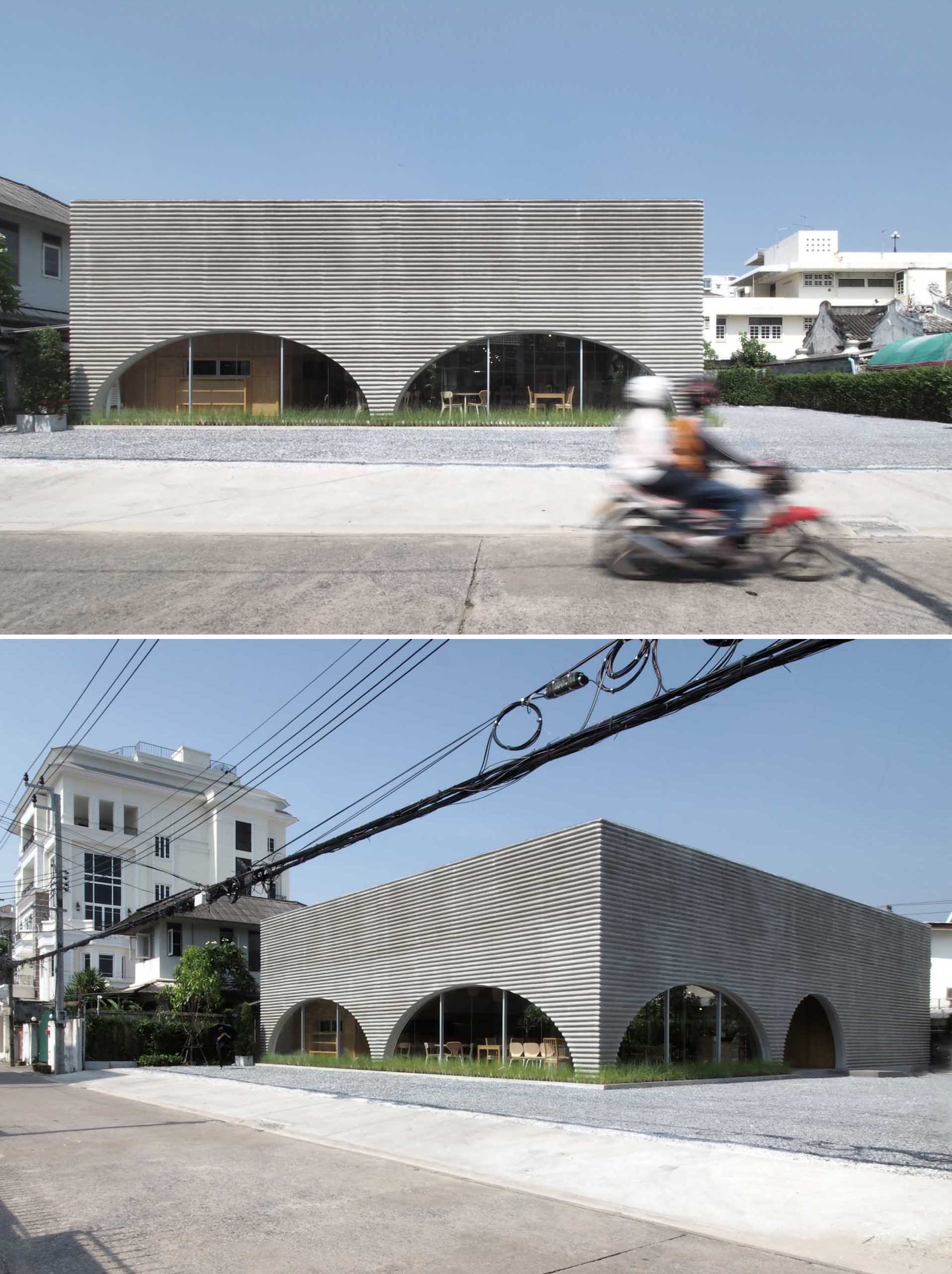 A modern restaurant and cafe with a wavy pre-case concrete facade and arched openings.