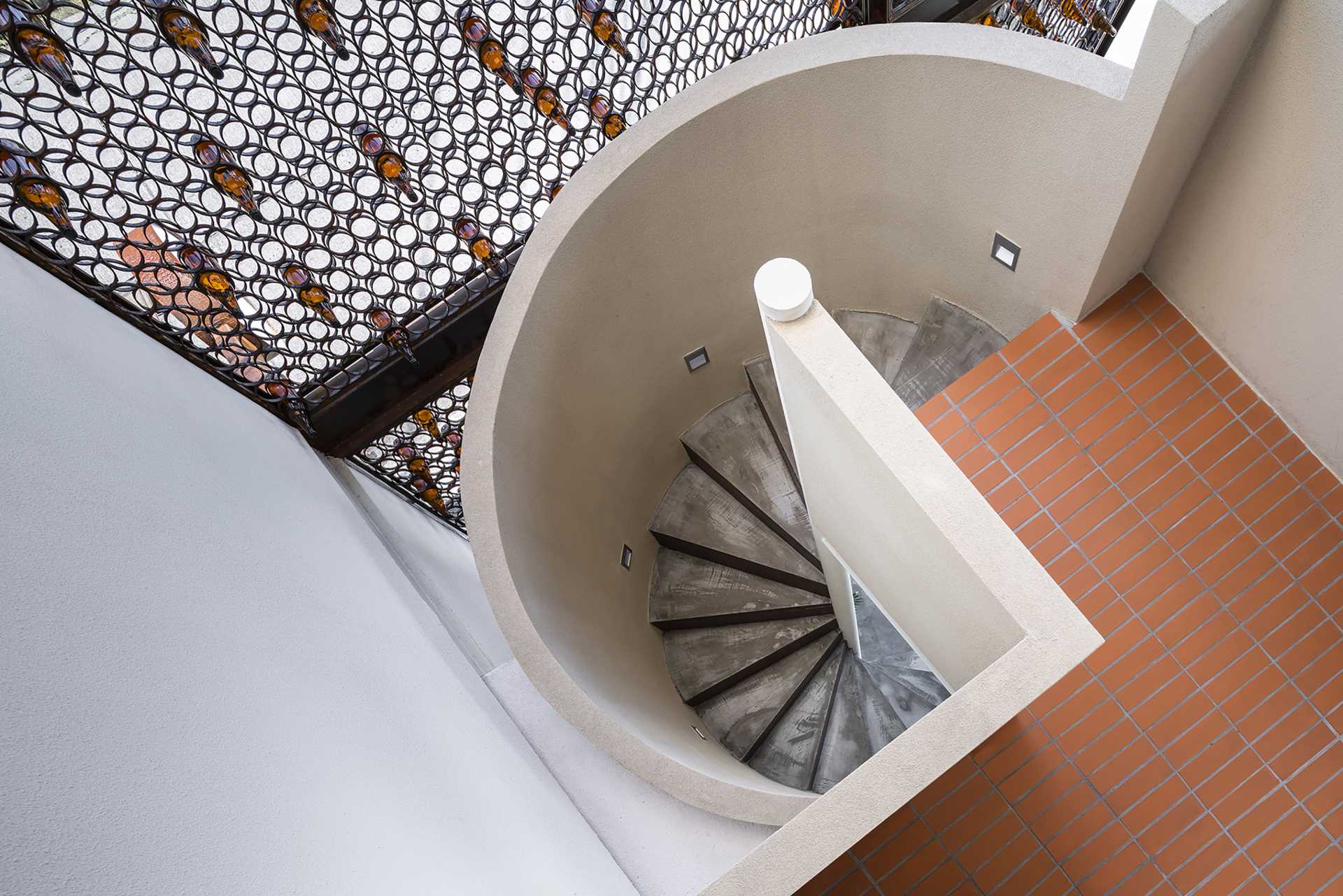 A spiral staircase leads from the main floor of this cafe up to the upper floor, and provides a close-up view of the facade.