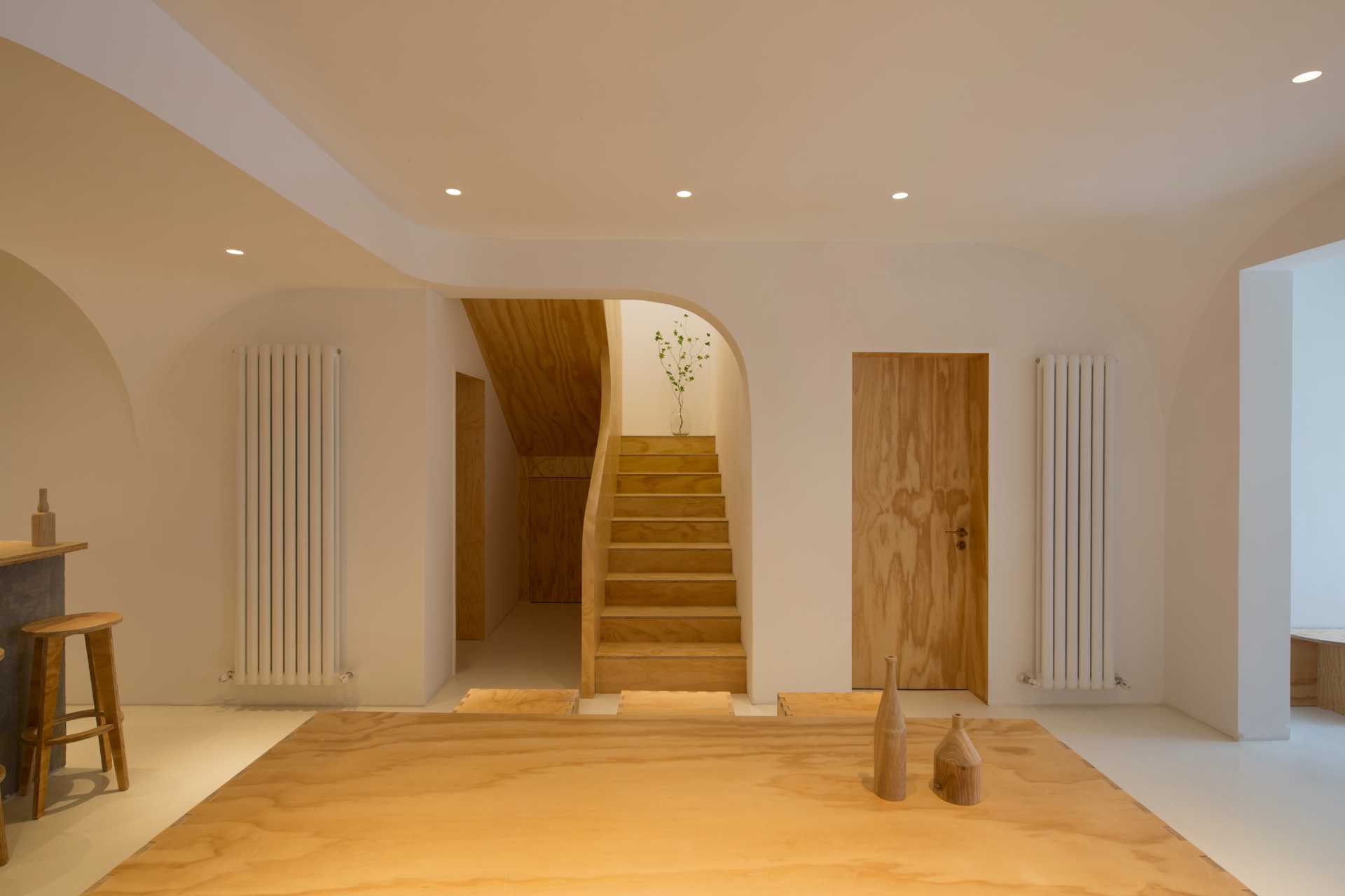 A boutique hotel with modern wood stairs.