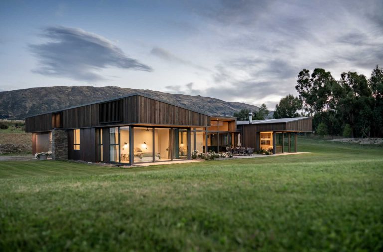 Sloping Rooflines Overhang The Separate Wings Of This Home