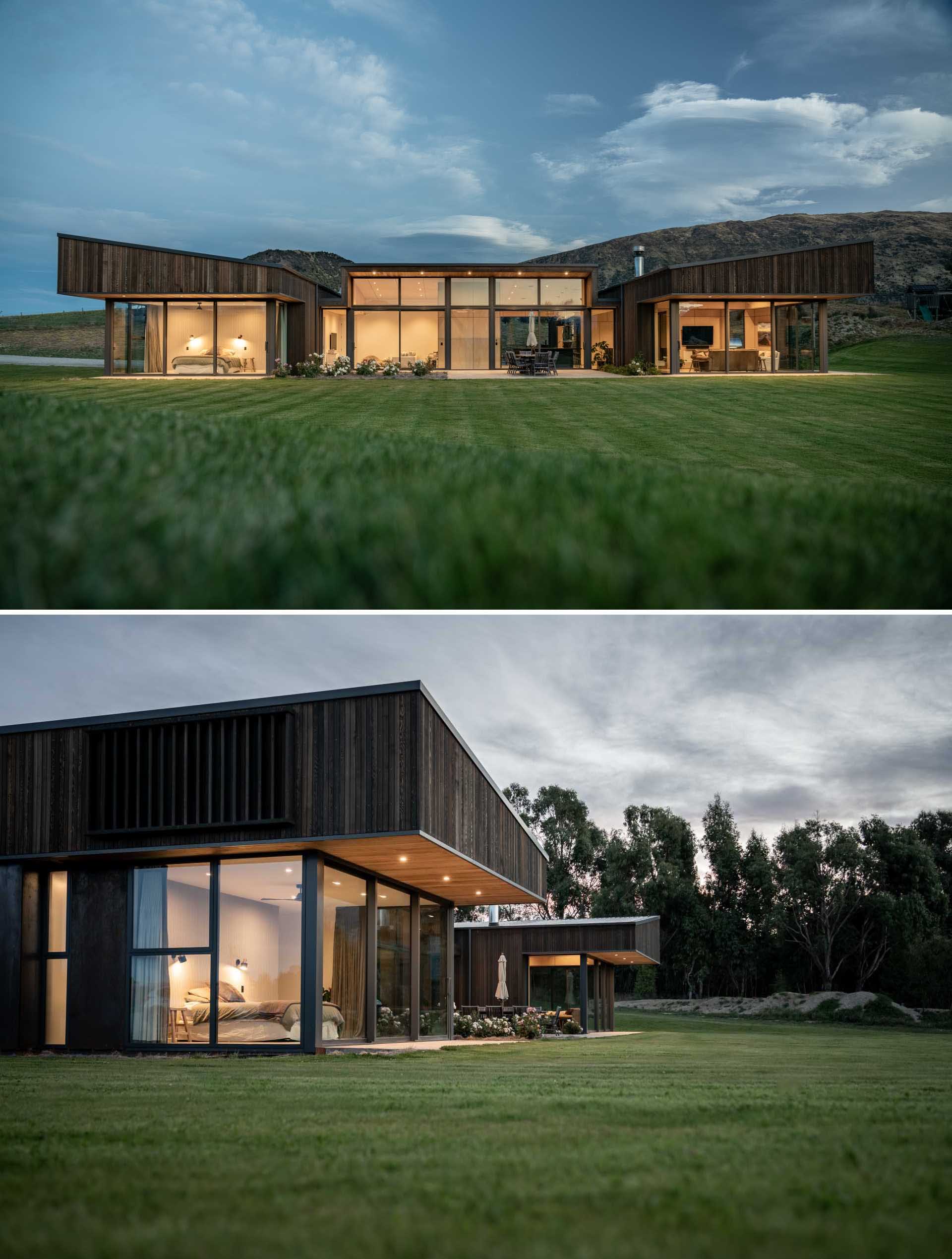 Rooflines on the outer wings slope towards the centre of this modern home, giving the building a contemporary aesthetic, which is furthered by robust overhangs.