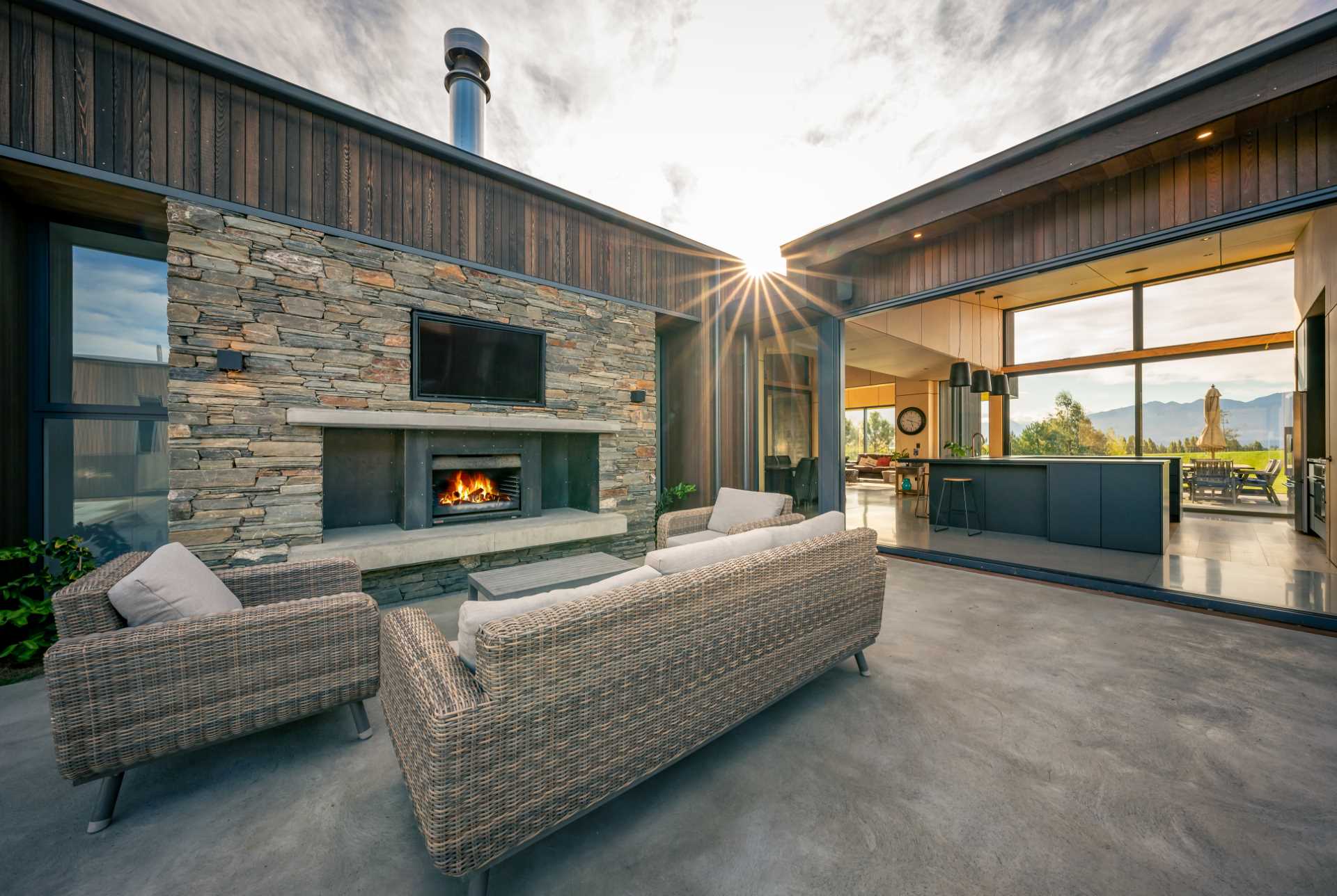 This sheltered patio encompasses an outdoor fireplace allowing it to be used year-round.