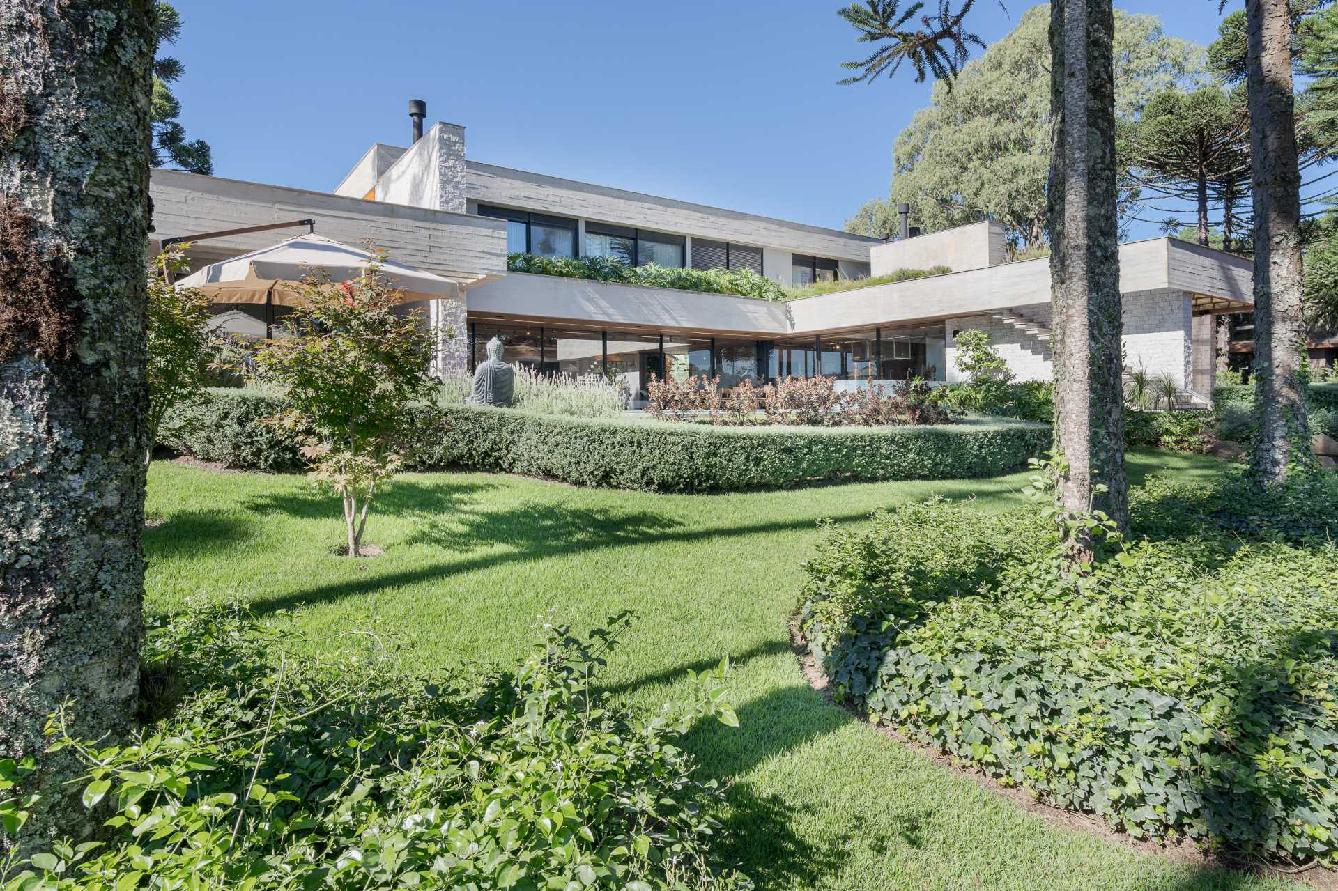 A modern home with landscaped gardens.