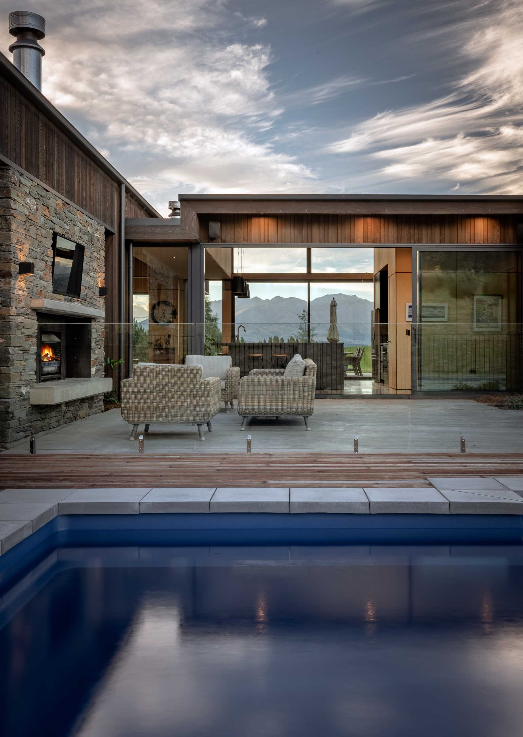 This sheltered patio encompasses an outdoor fireplace allowing it to be used year-round.