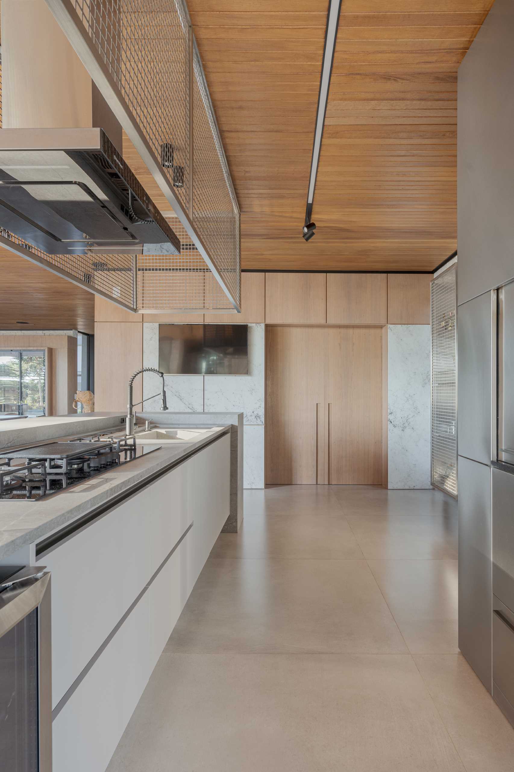 A modern kitchen with a long island.