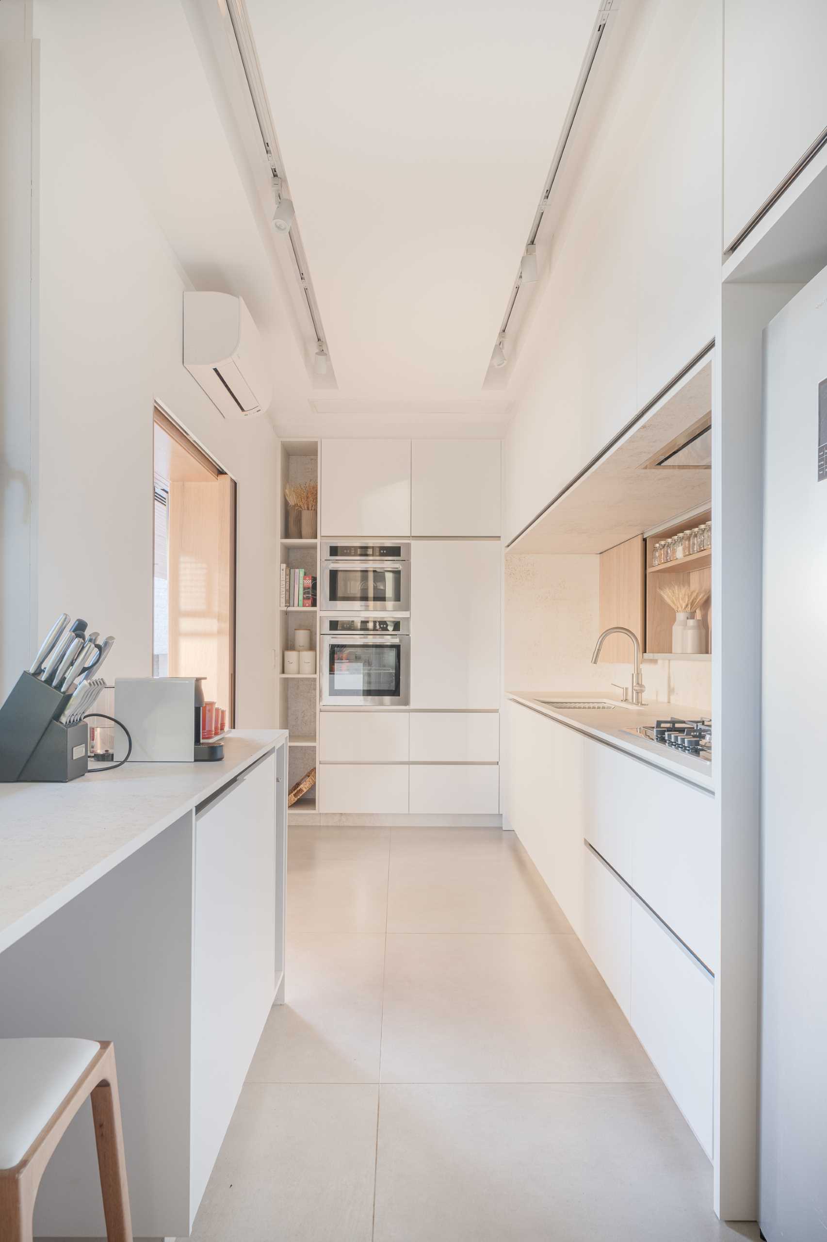 A modern prep kitchen with plenty of pantry space.