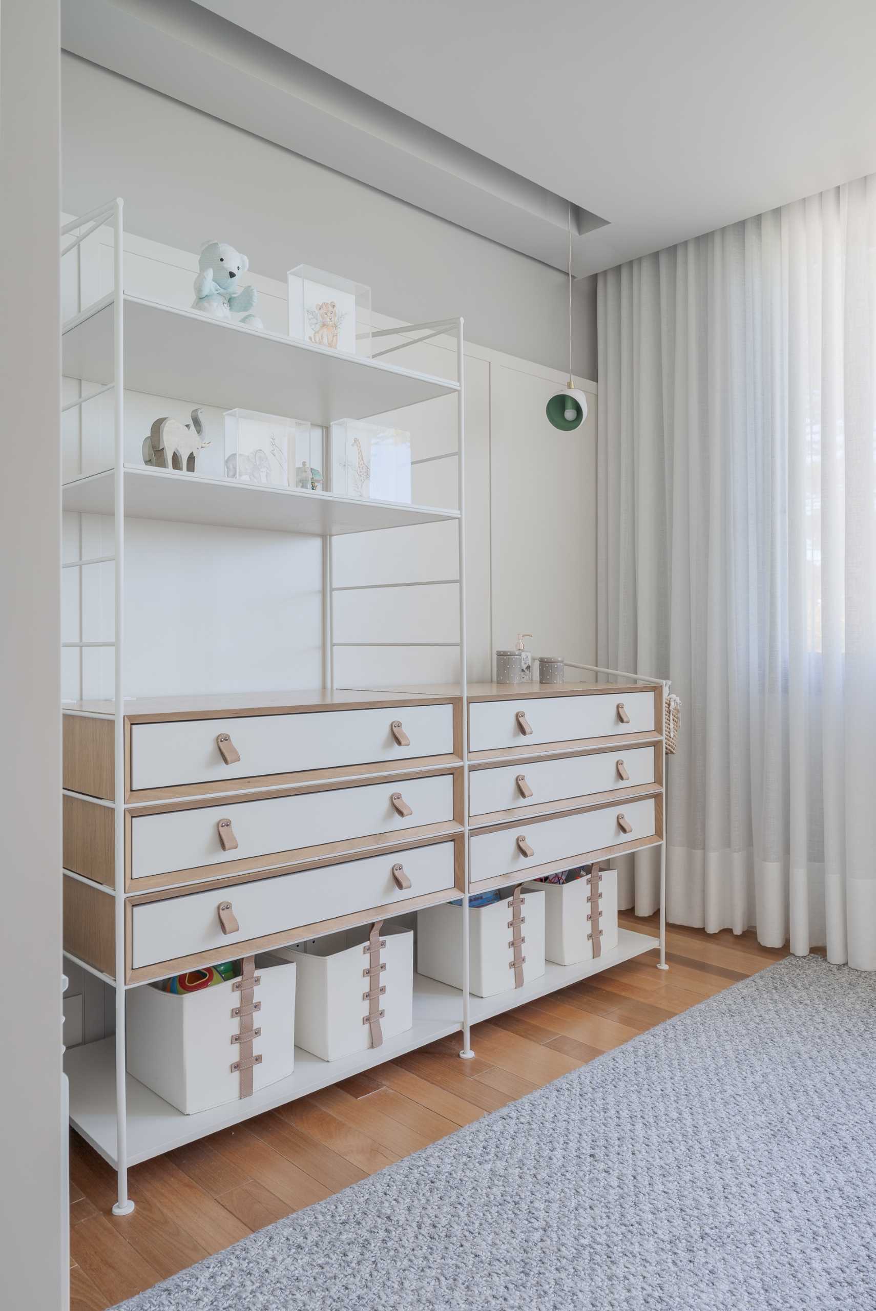 A modern nursery with a shelving unit.