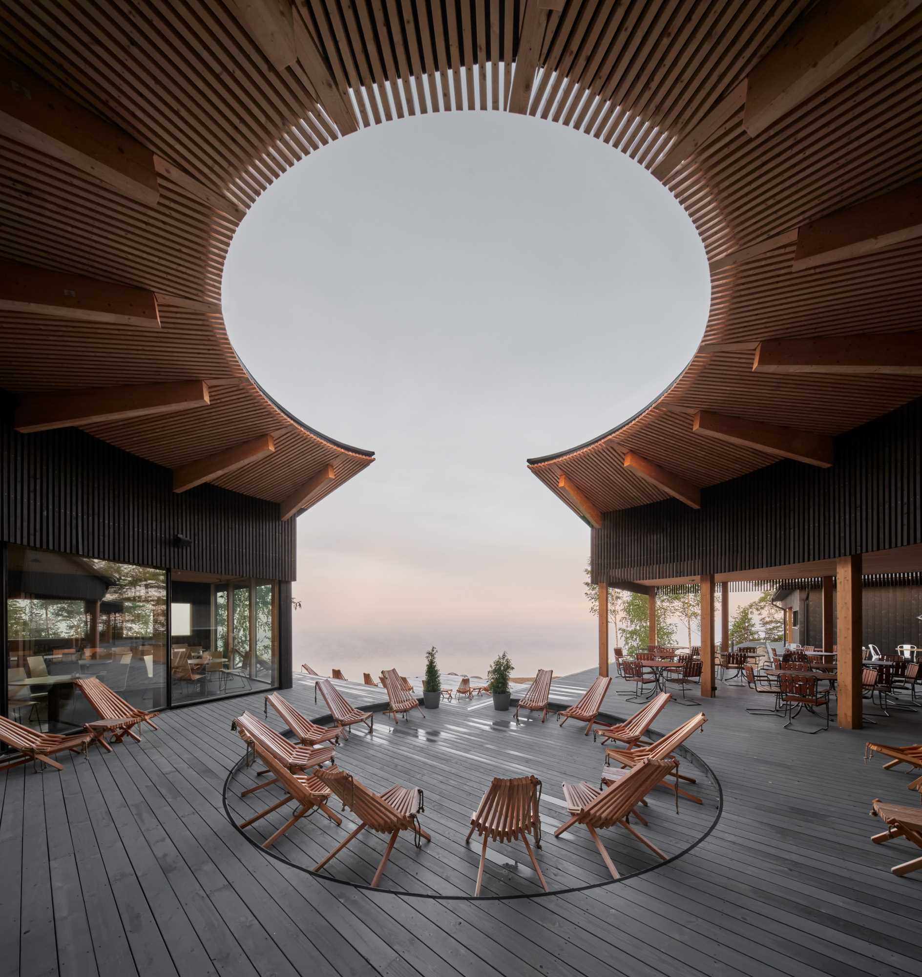The curved inner courtyard of this modern restaurant creates viewpoints both in and out of the building.