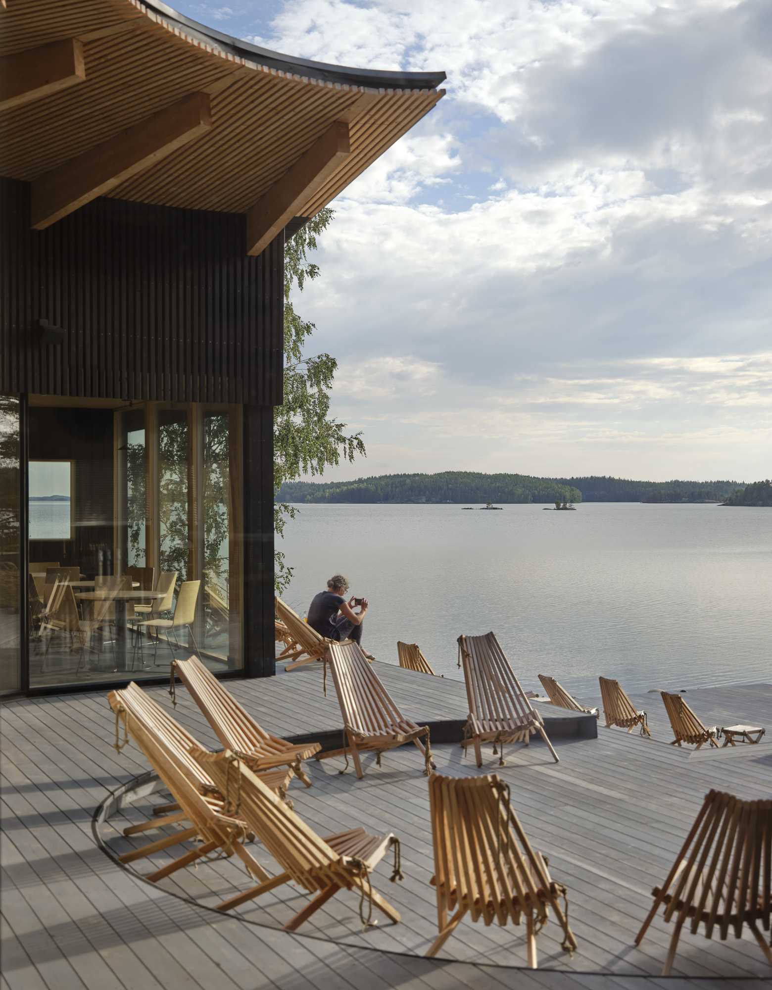 A modern restaurant with terraced outdoor seating.