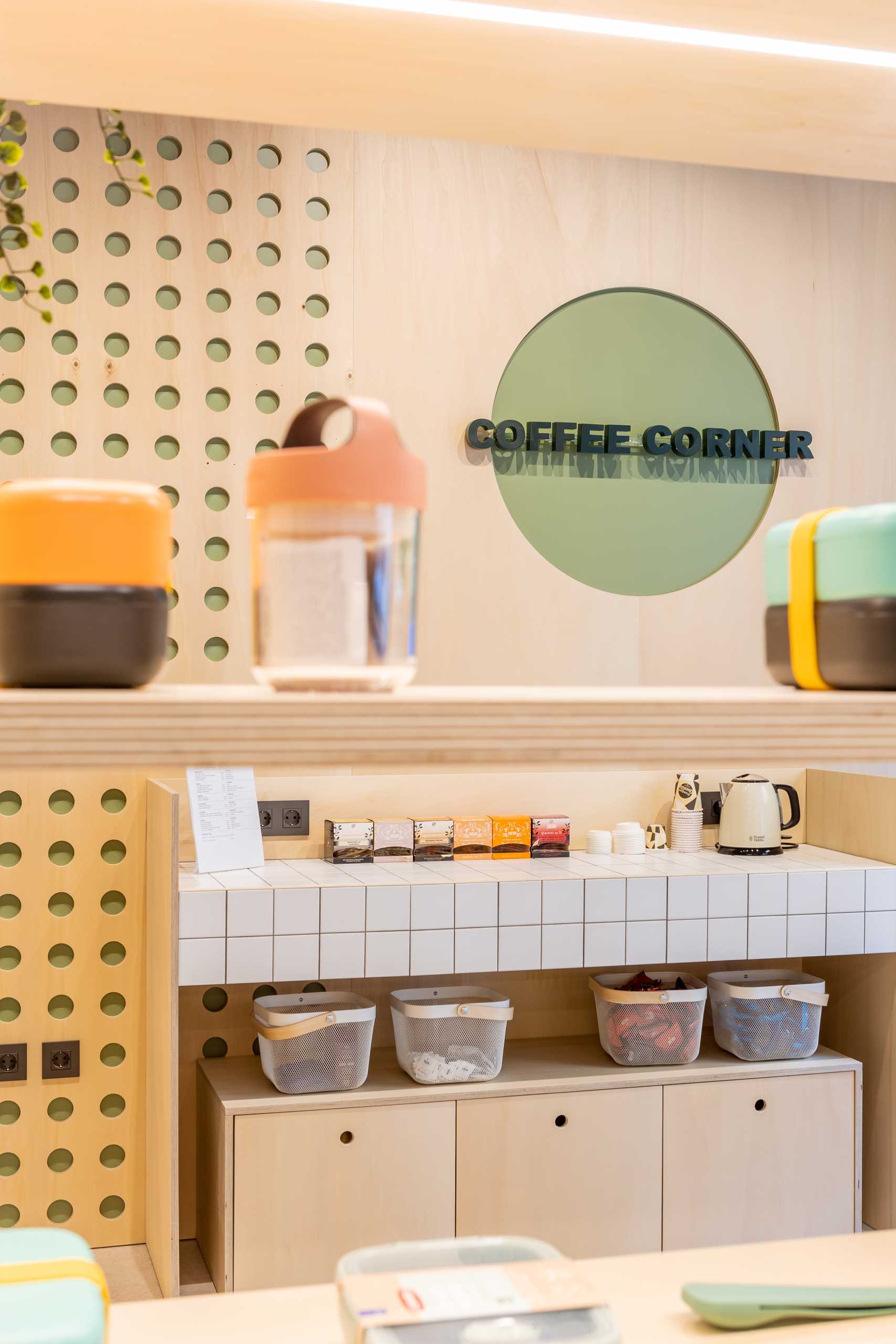 A modern takeaway shop with wood panels and shelves.