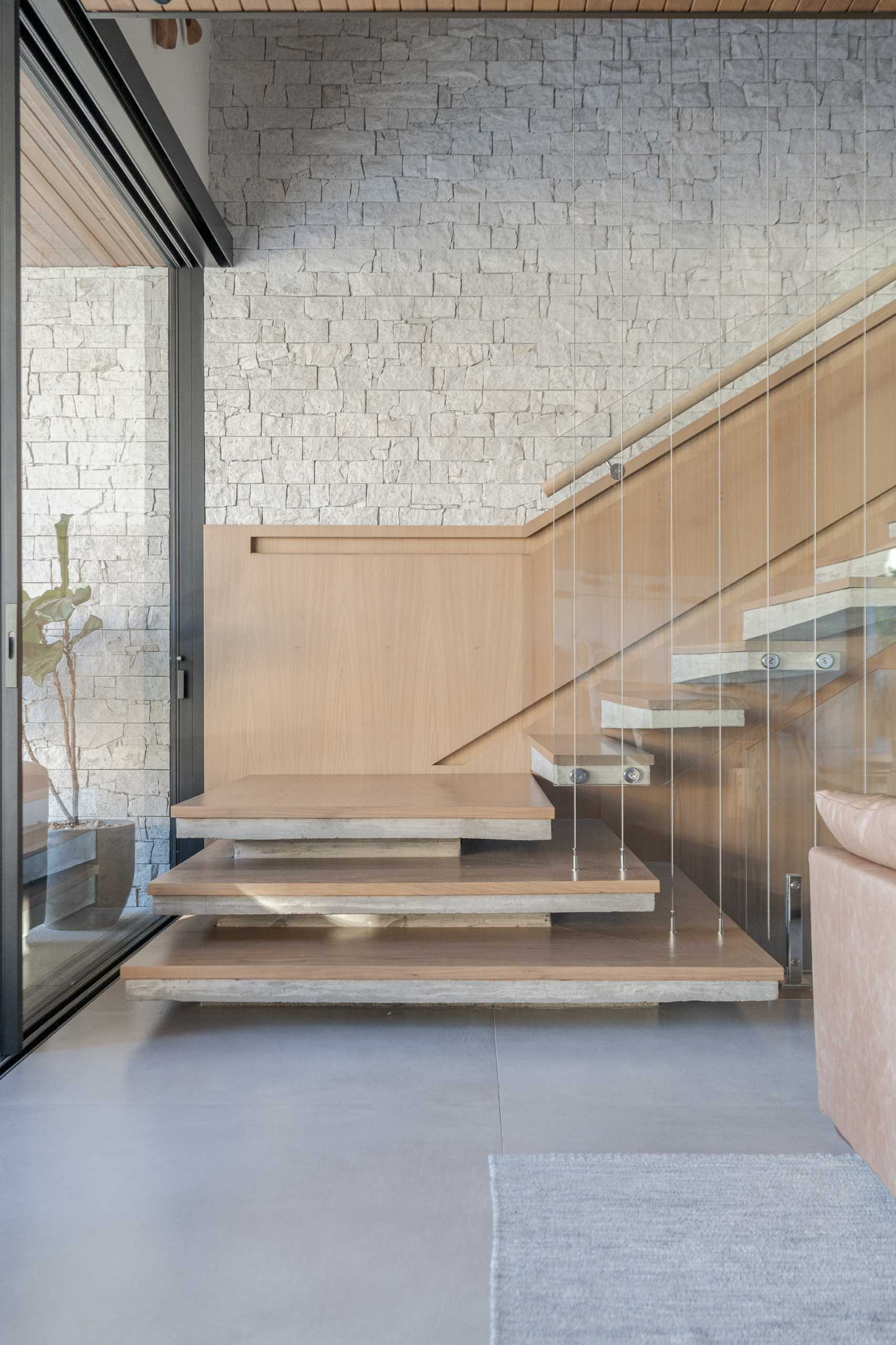 Modern wood and concrete stairs with hidden lighting.