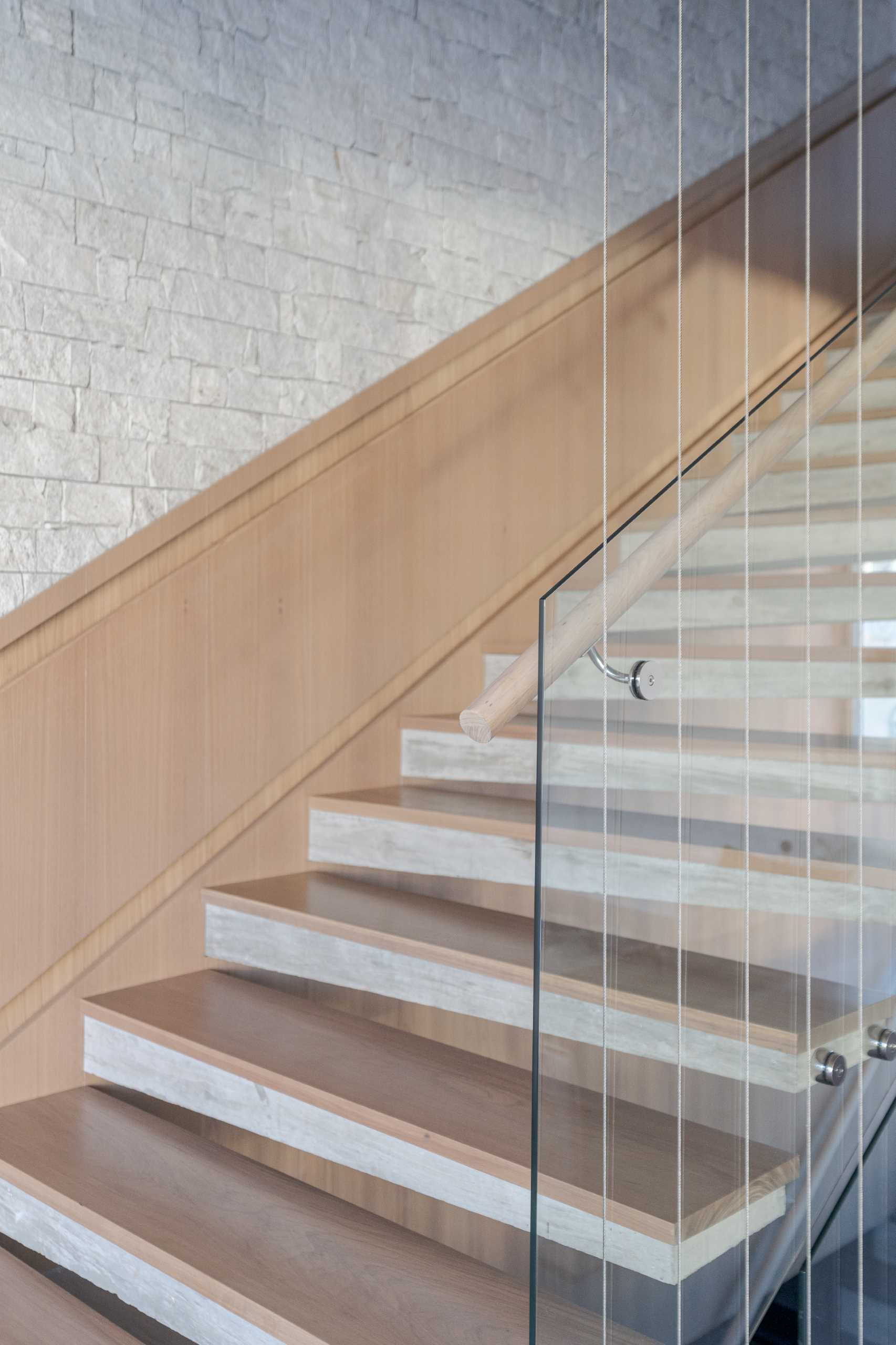 Modern wood and concrete stairs with hidden lighting.