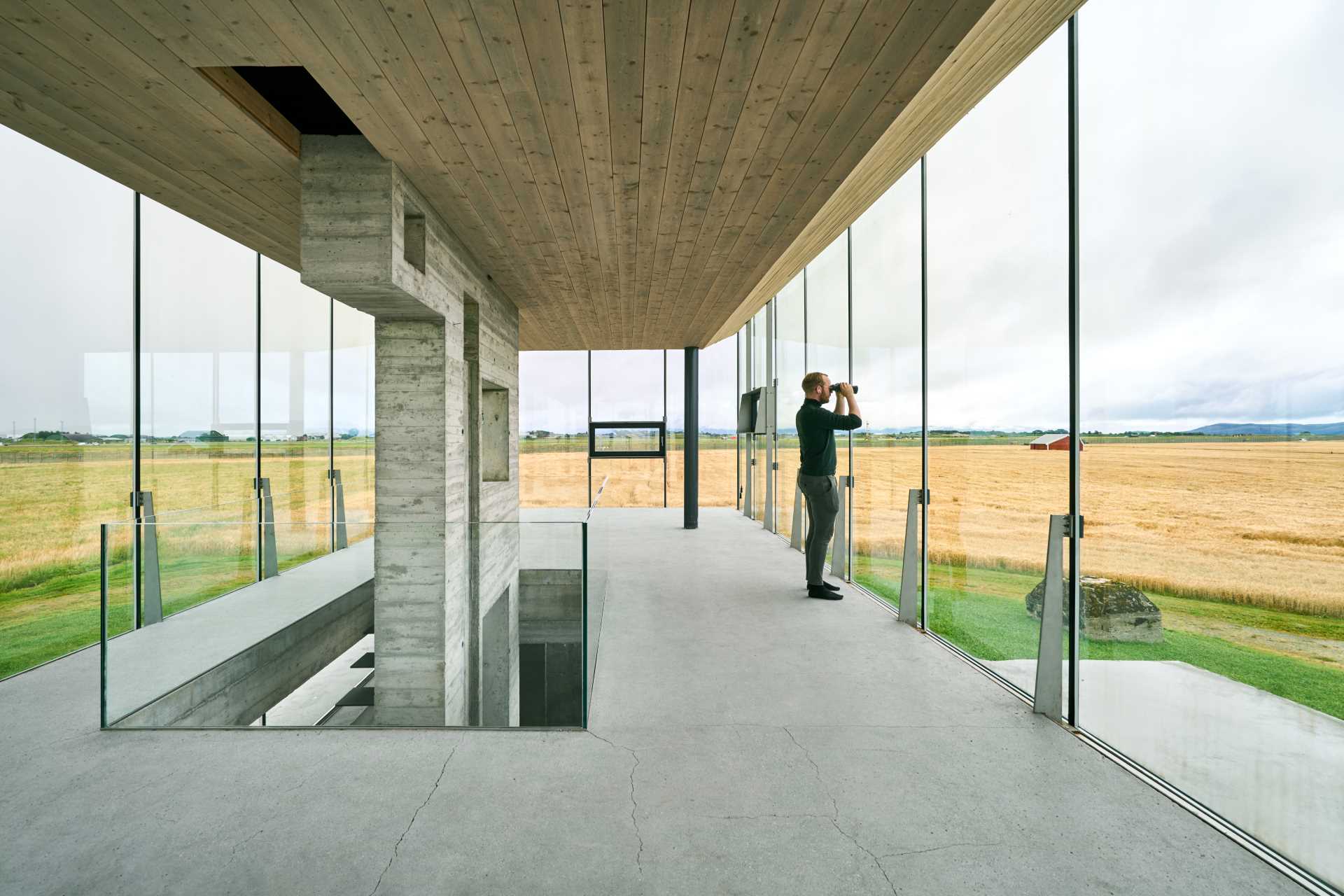 The floor-to-ceiling windows of this event space provide an unobstructed 360-degree panoramic view of nature, wildlife, and the air base.