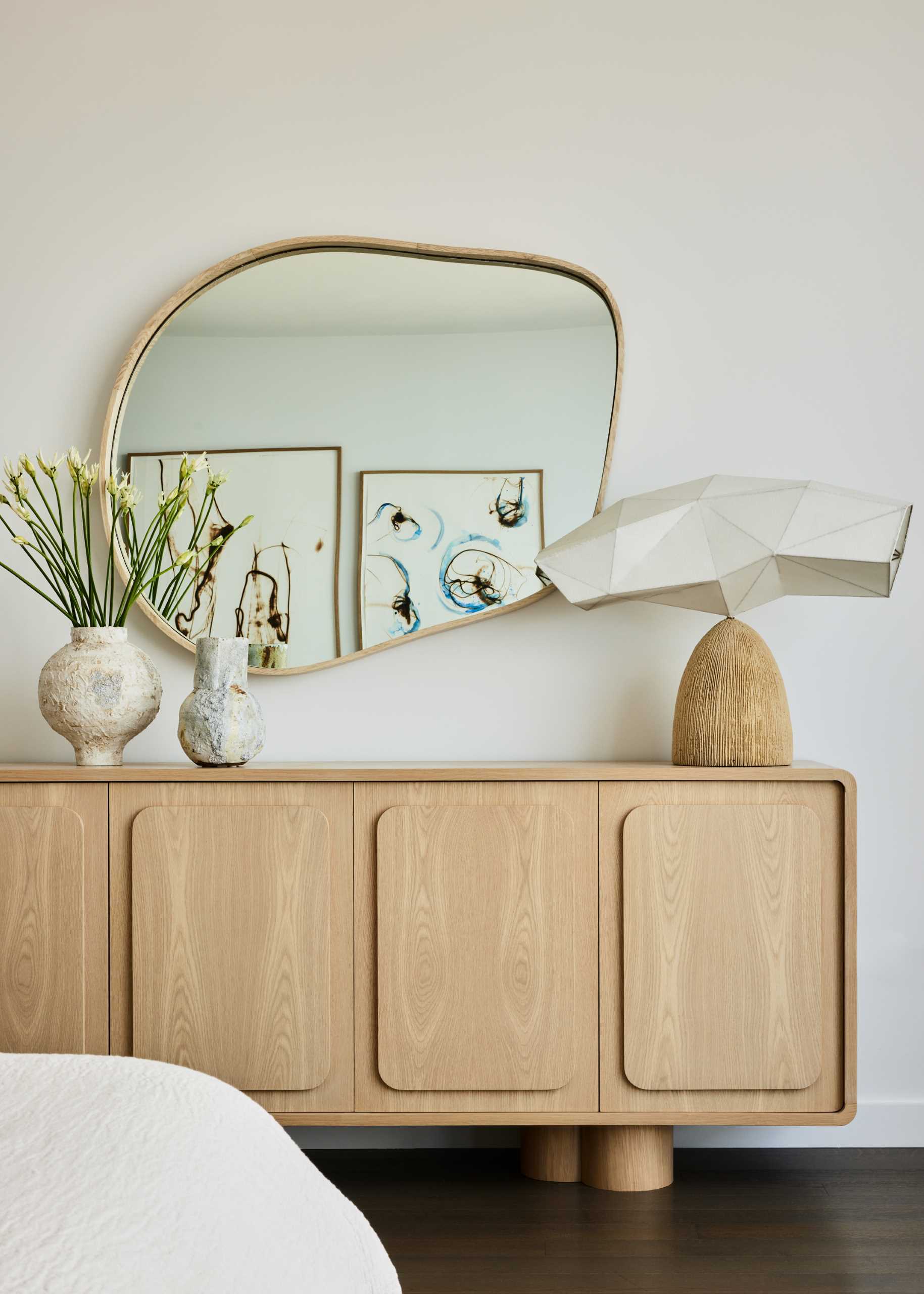 A Webcoat table lamp by Steven Haulenbeek rests on a custom credenza.