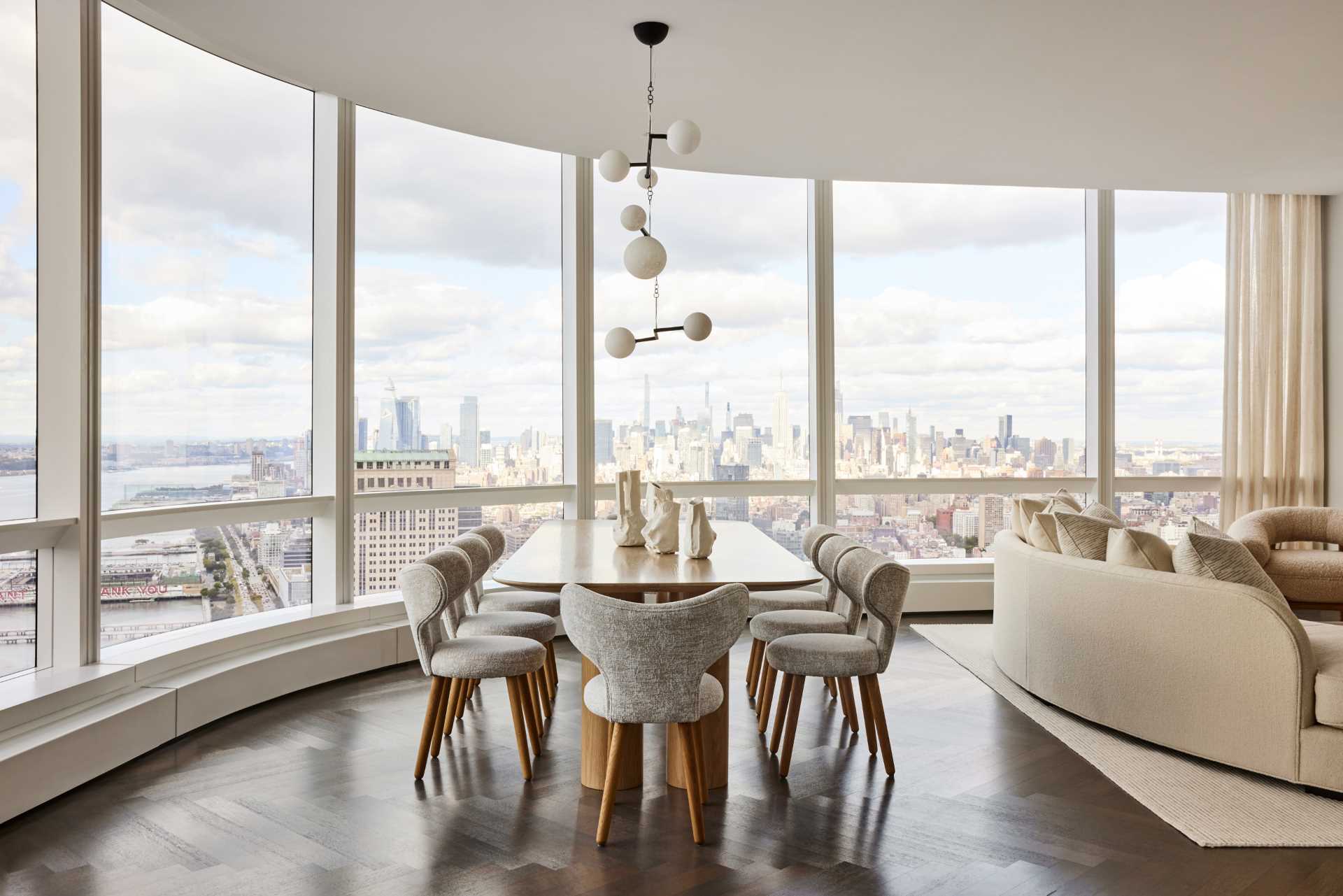 A Ludovic Clement d’Armont mobile light hangs over the oak dining table, also designed by Jessica Gersten. The contour theme continues with the “wing” dining chairs from Studio Twenty-Seven.