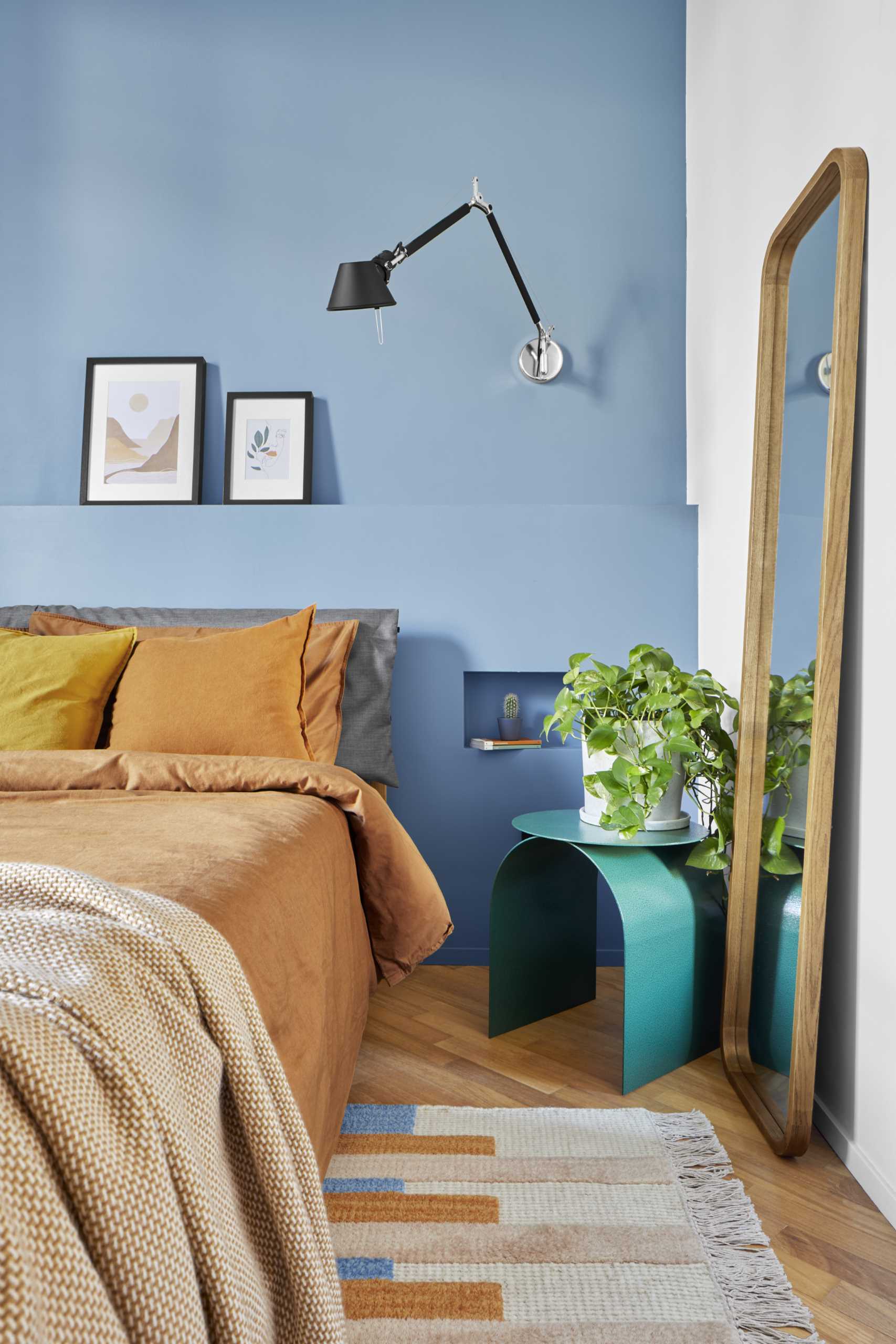 A section of the wall in this bedroom has been brought forward to include two built-in bedside tables.