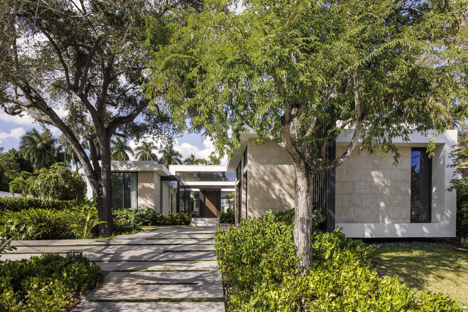 A modern home with coral stone walls.