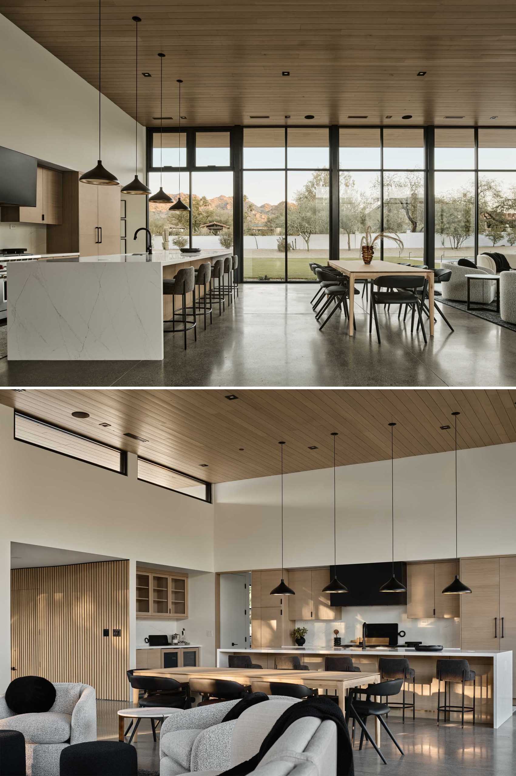 The dining area and kitchen both include wood elements, complementing the wood ceiling above.