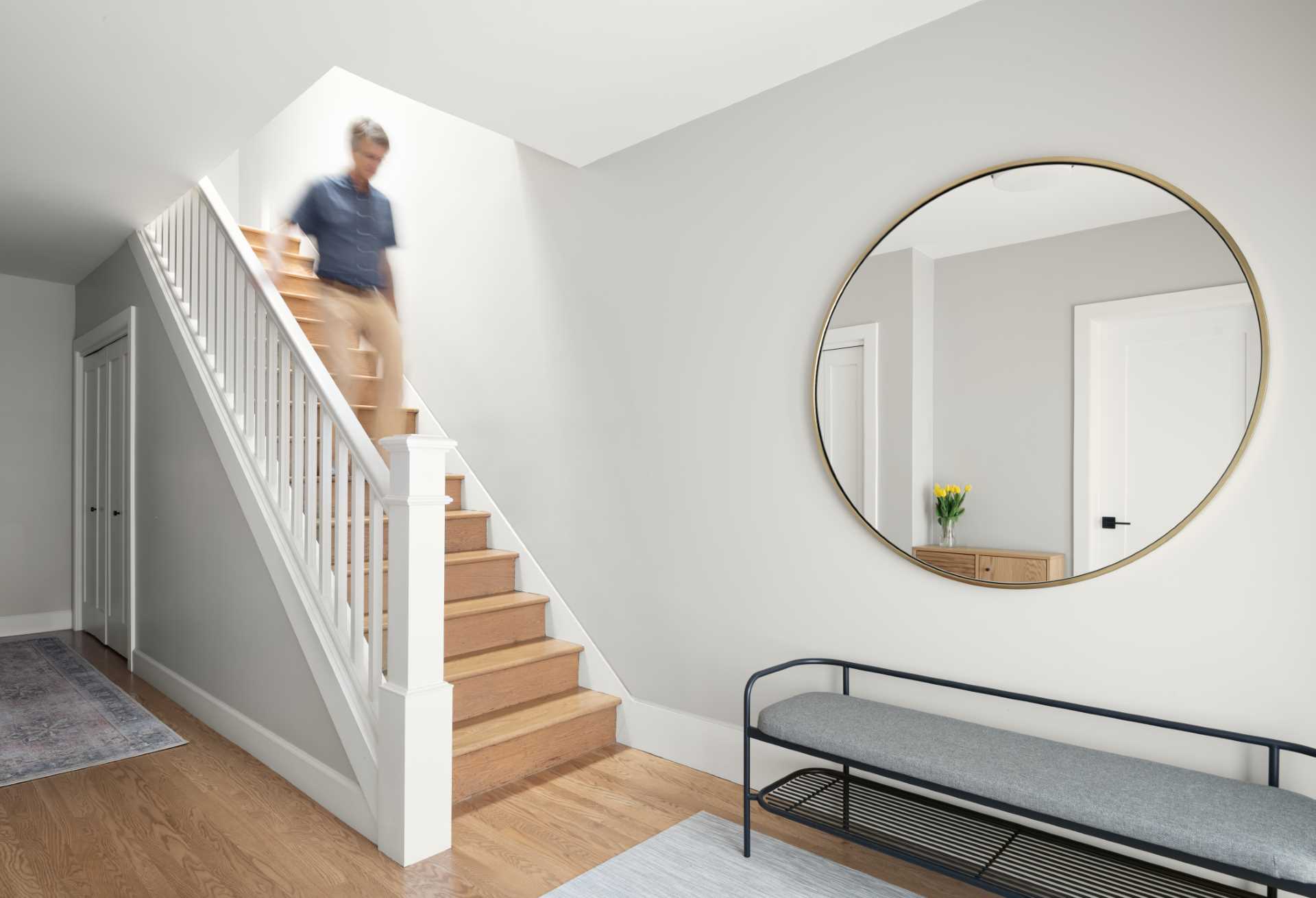 Stairs lead from the entryway to the social areas of the home upstairs.