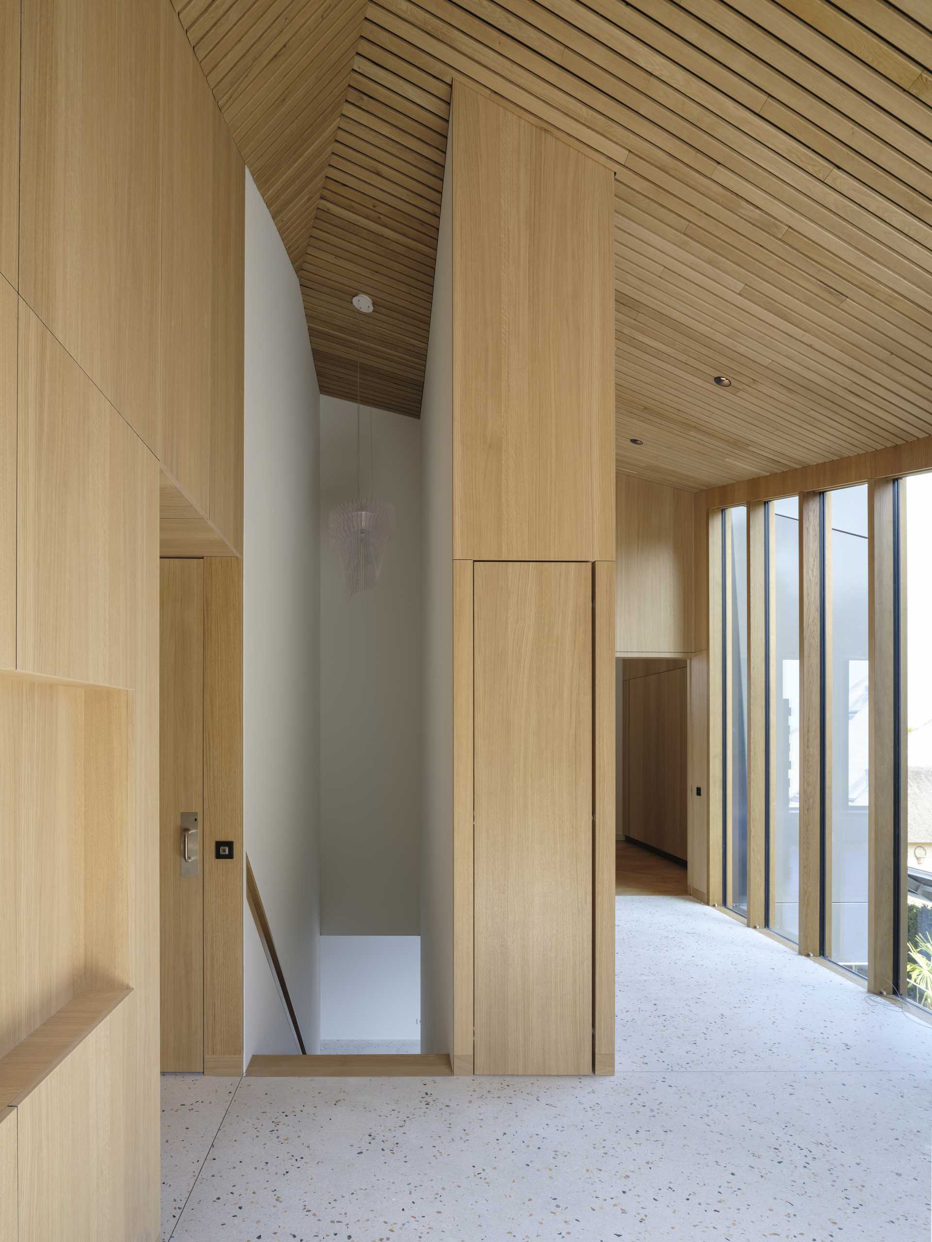 A modern house with a wood-lined interior.