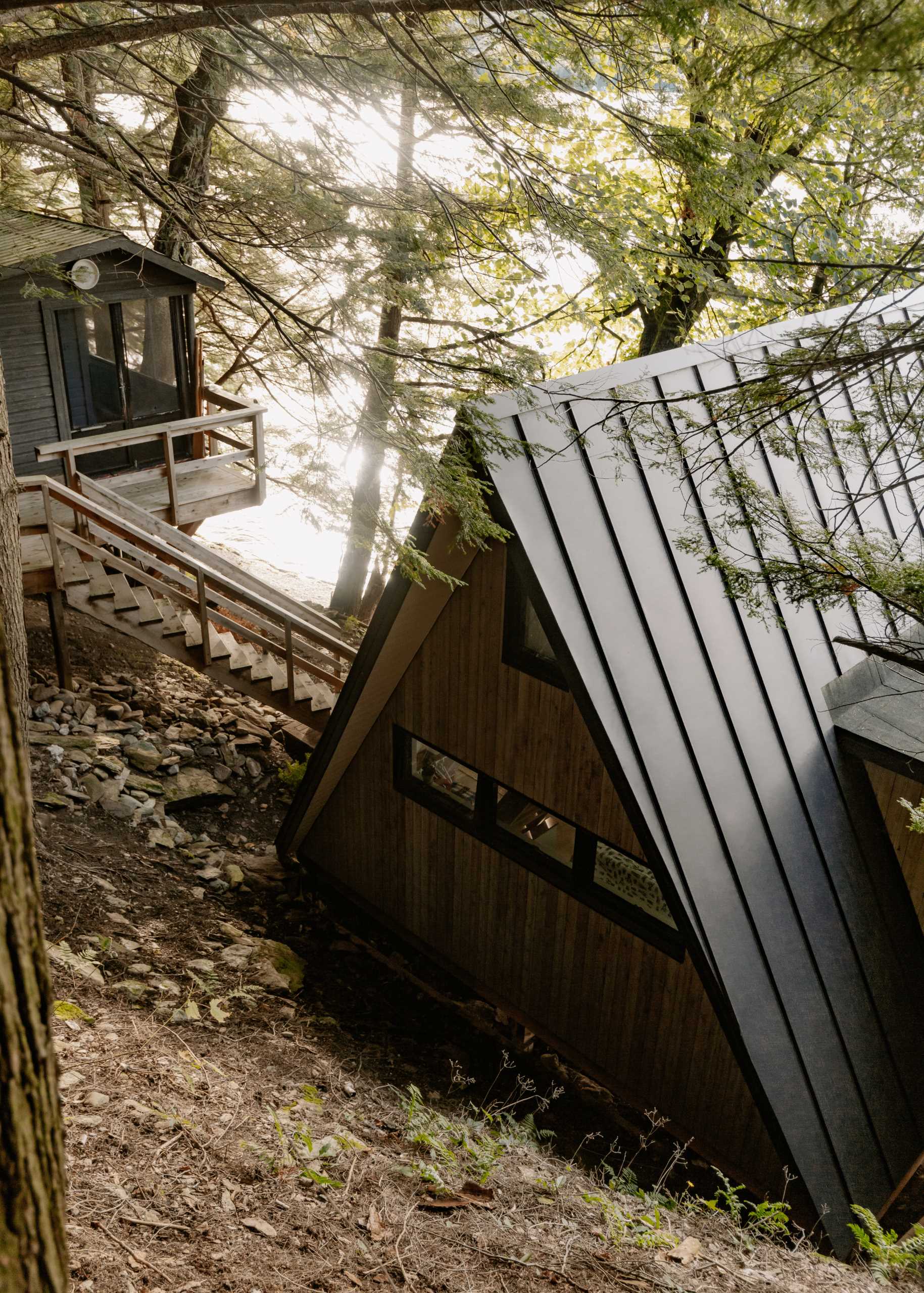 An A-Frame cabin with dark exterior.