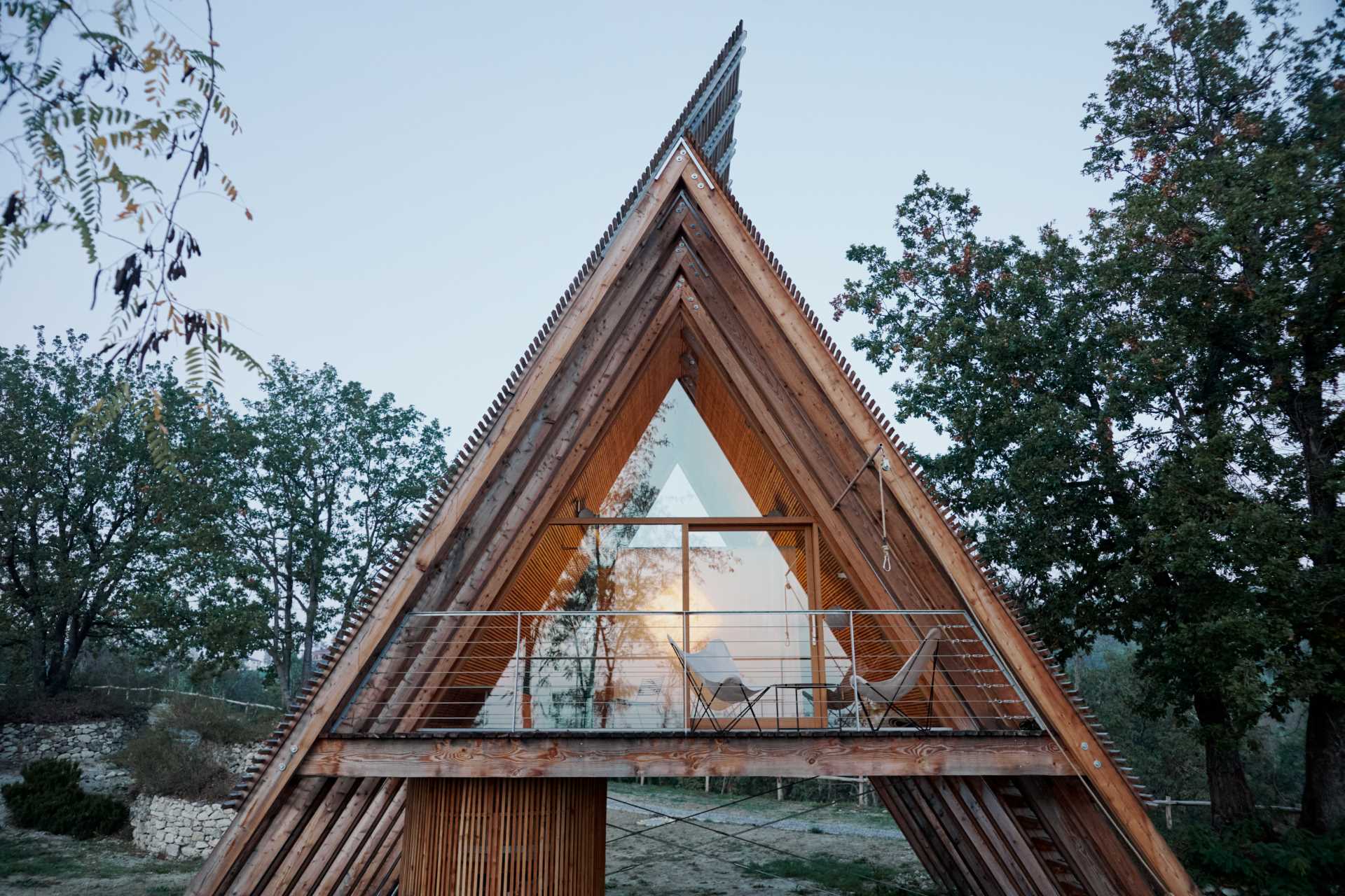 This modern A-frame cabin is made of larch treated only with oil, a natural element that’s absorbed into the wood, enriching and nourishing it as it ages.