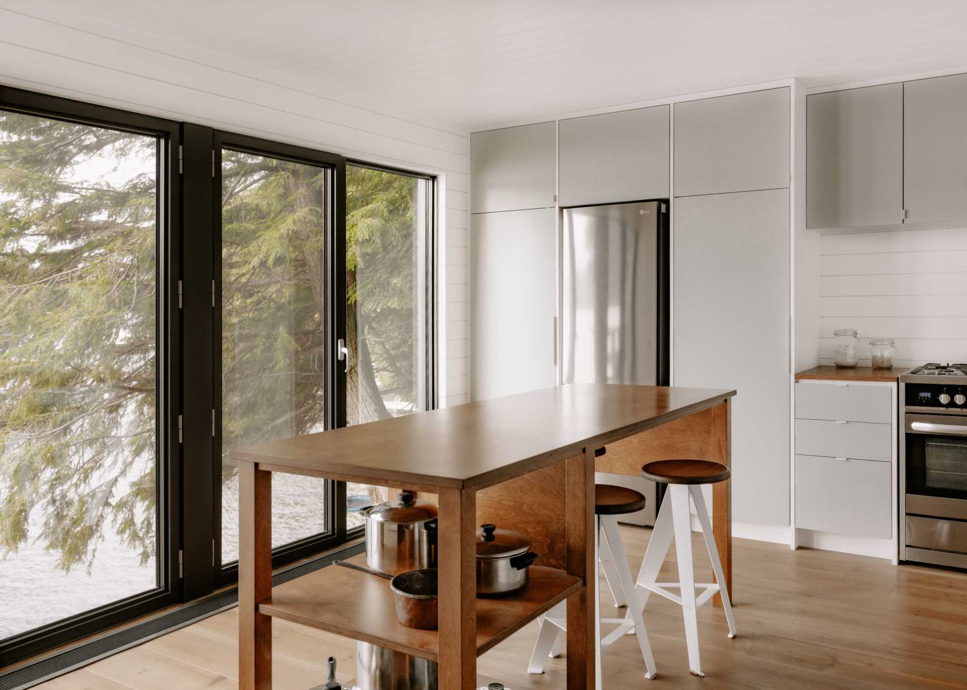 Modern kitchen inside an updated A-Frame cabin.