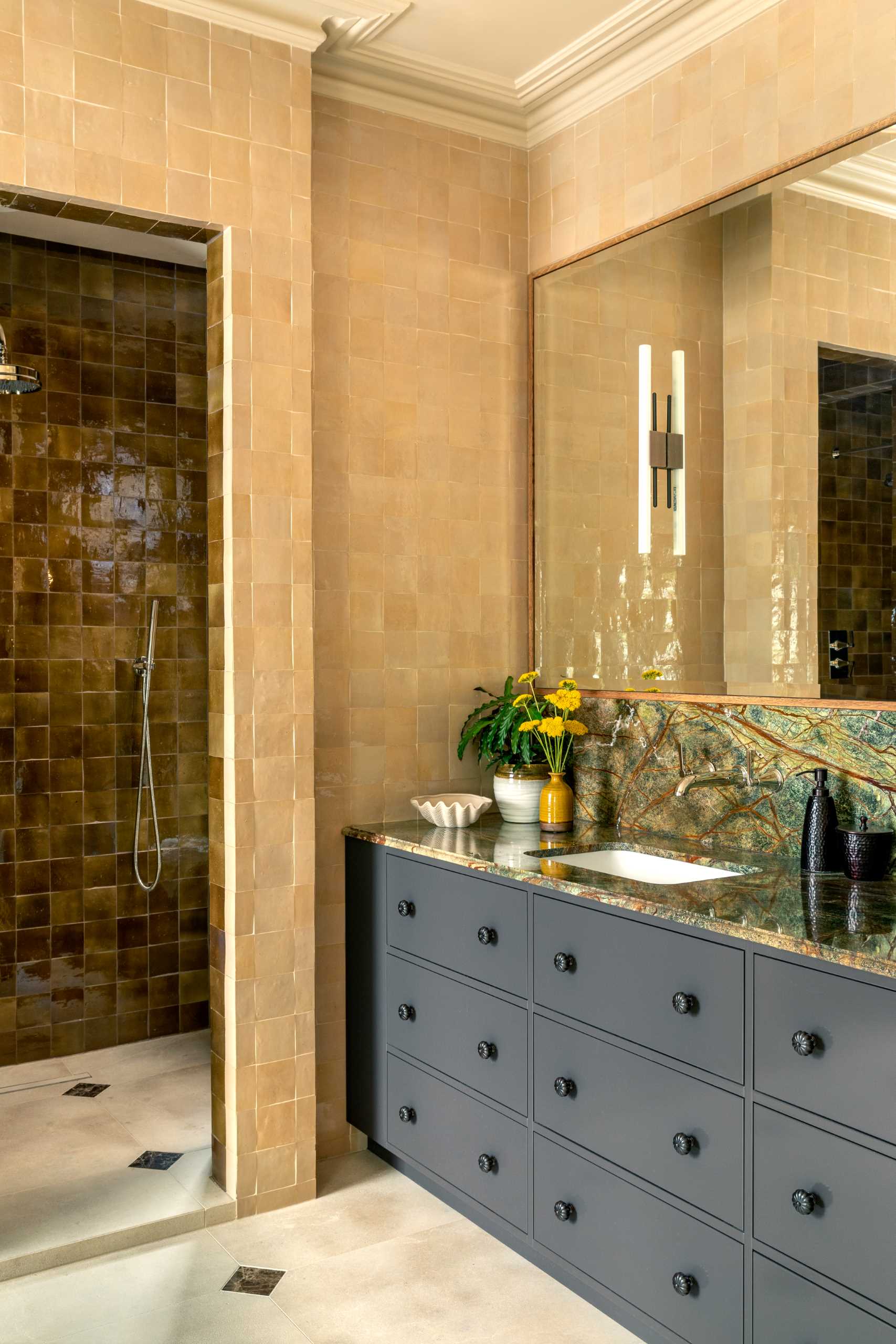 A bathroom with two colours of square tiles.