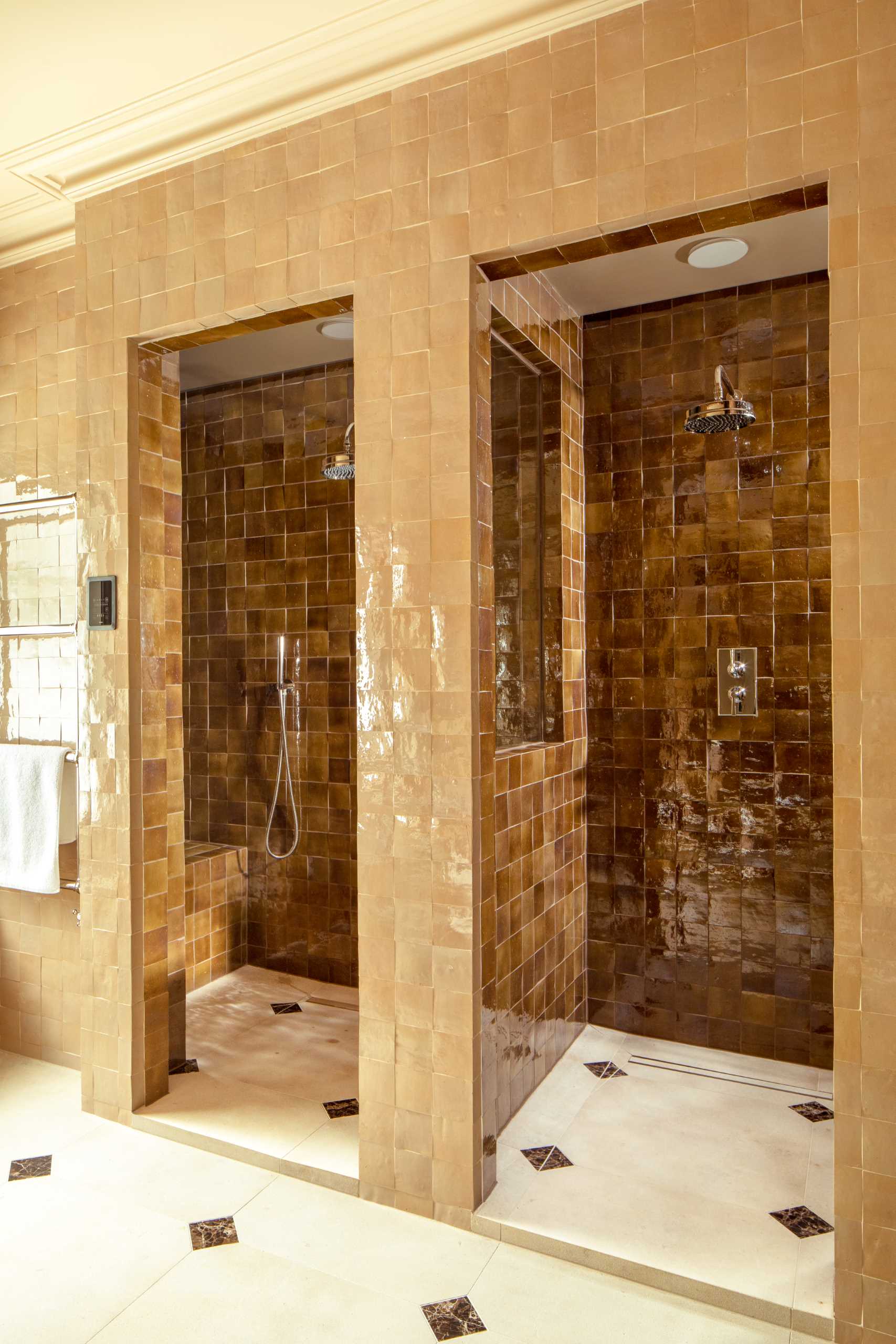 A bathroom with two colours of square tiles.