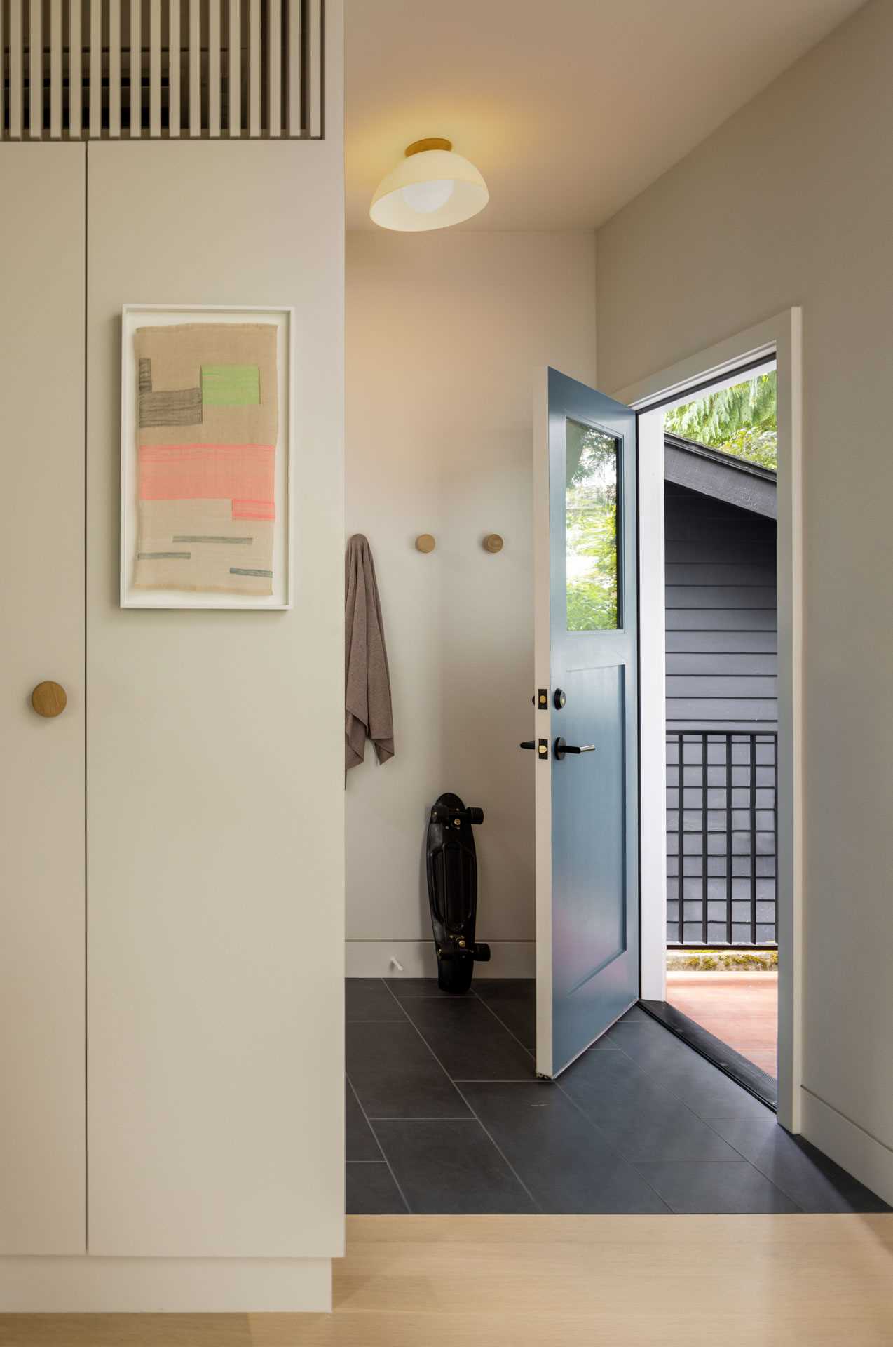 A contemporary entryway with a natural palette.