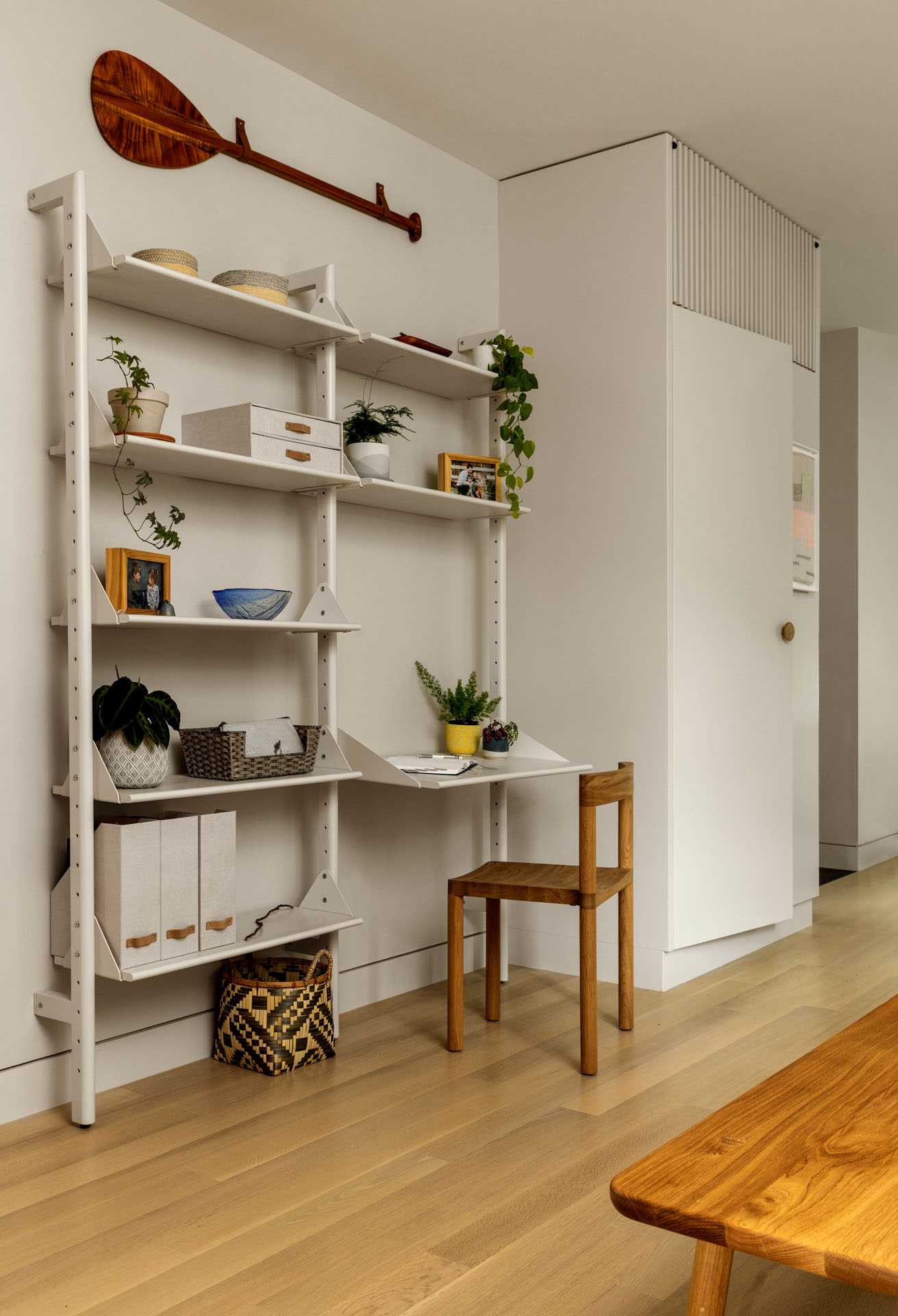 A shelving unit that includes a desk.