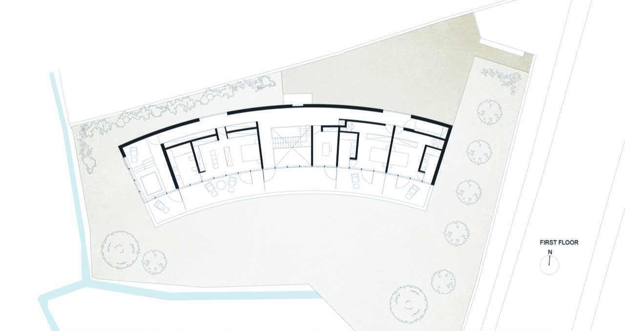 The floor plan of a modern home with a curved design.