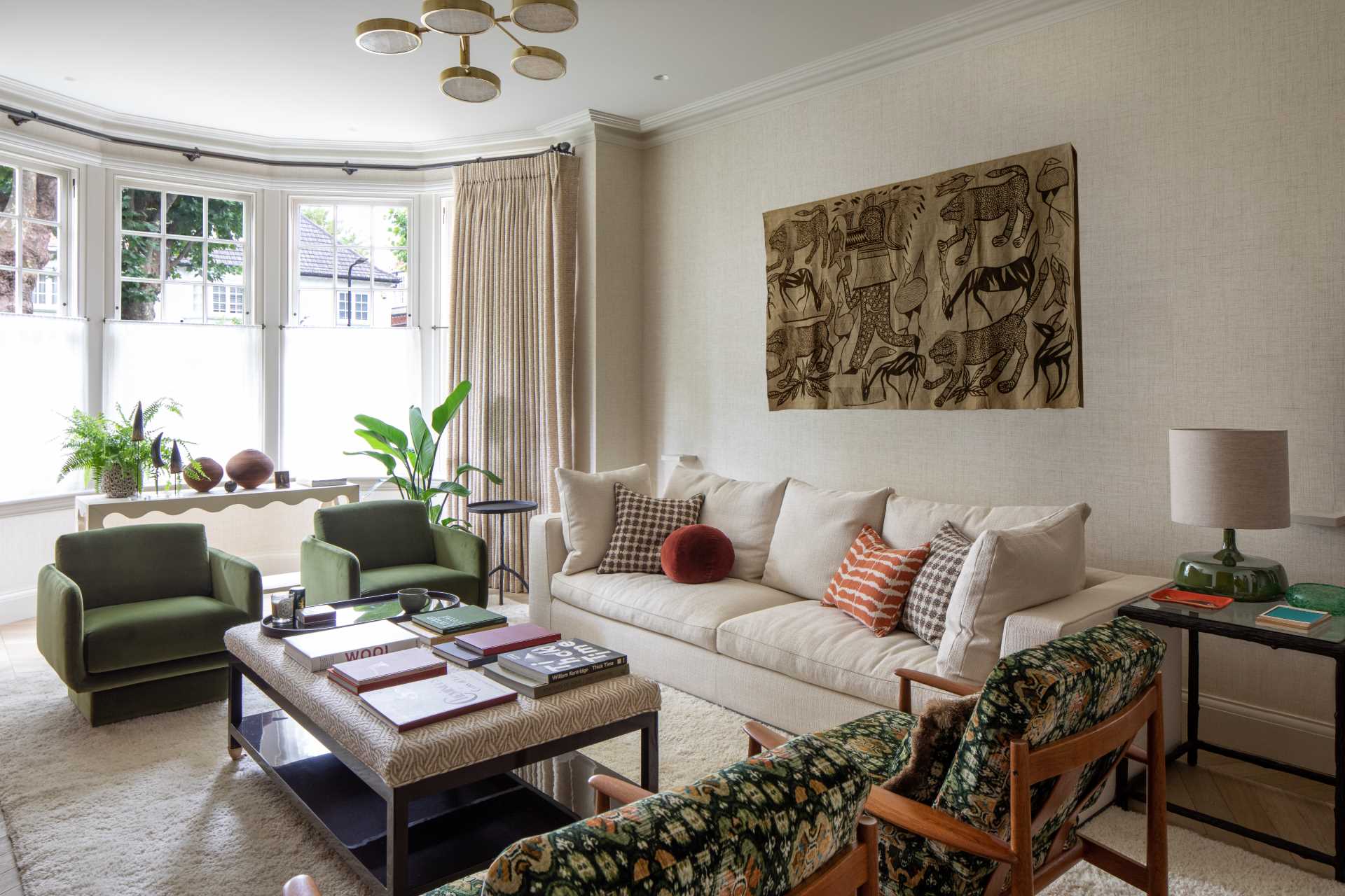 A living room with a bay window.