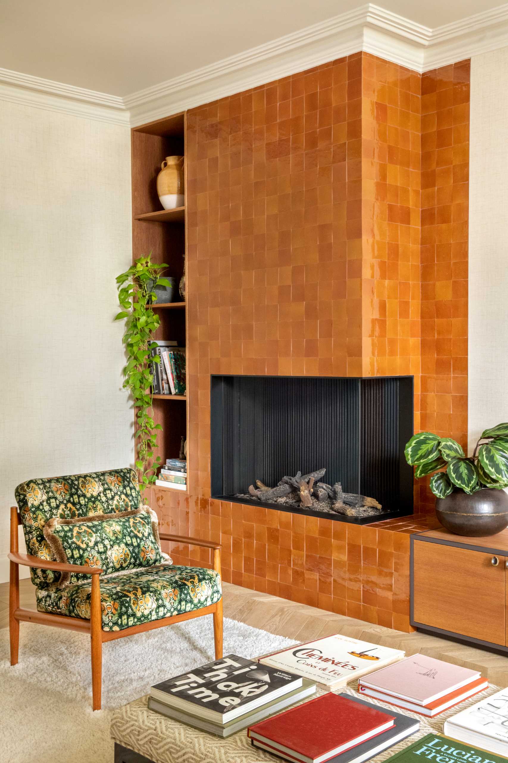 A tile-covered fireplace surround makes a bold statement in this living room.