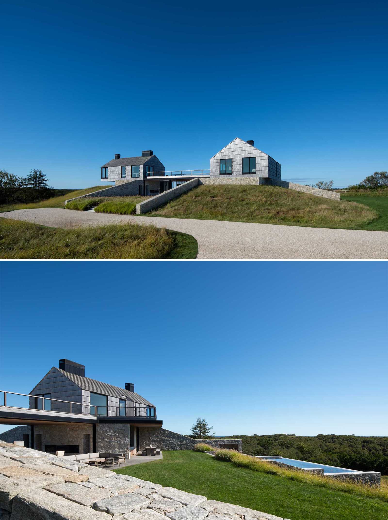 A modern home with two stone and shingle "cottages" connected by an open living room, dining area, and kitchen.