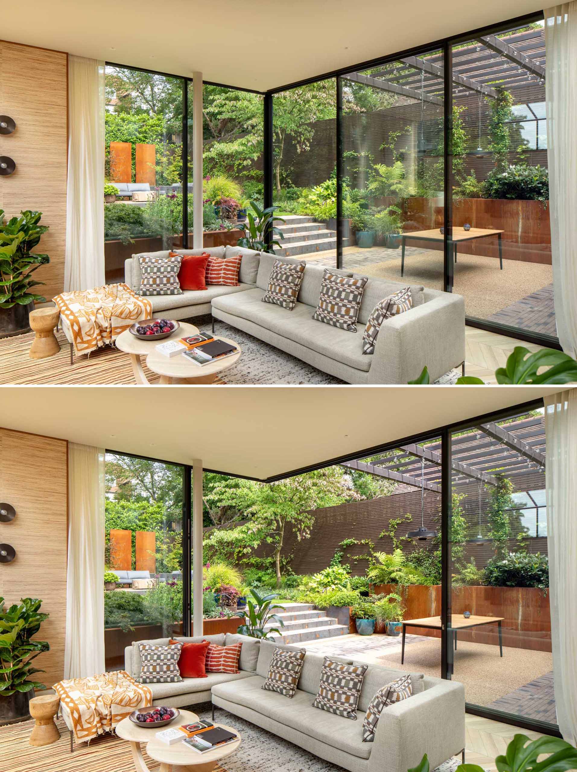 The house wraps around an outside dining space which then leads up a few steps into the landscaped garden with evergreen plants. Sliding glass walls open the living room to this outdoor space while allowing natural light to flood the interior.